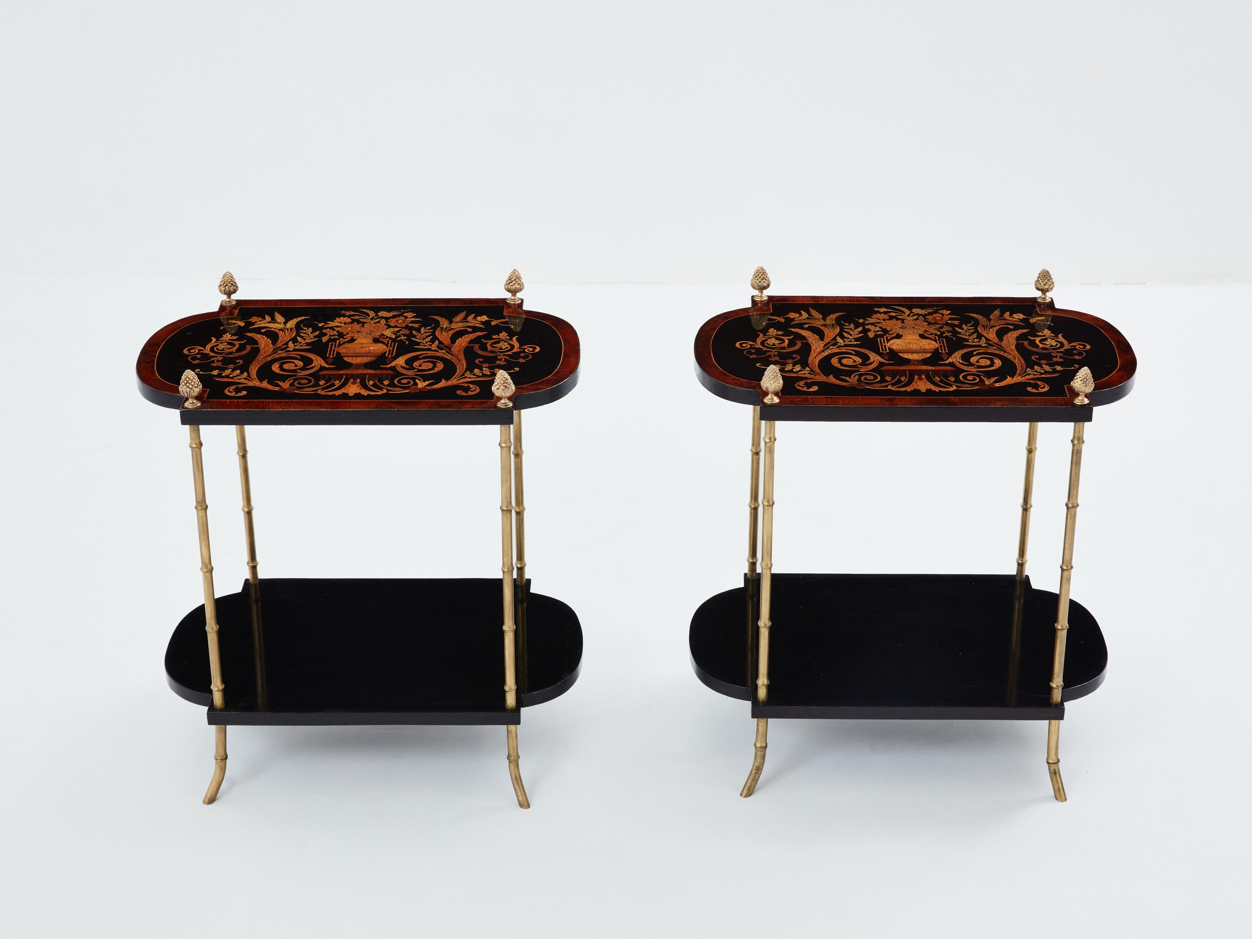 This unique pair of two-tier Maison Baguès side tables was created with solid bamboo shaped bronze and beautiful ebonized pearwood and marquetry tops in the late 1940s. The antique floral table tops marquetry, made out of stained maple, is a work of