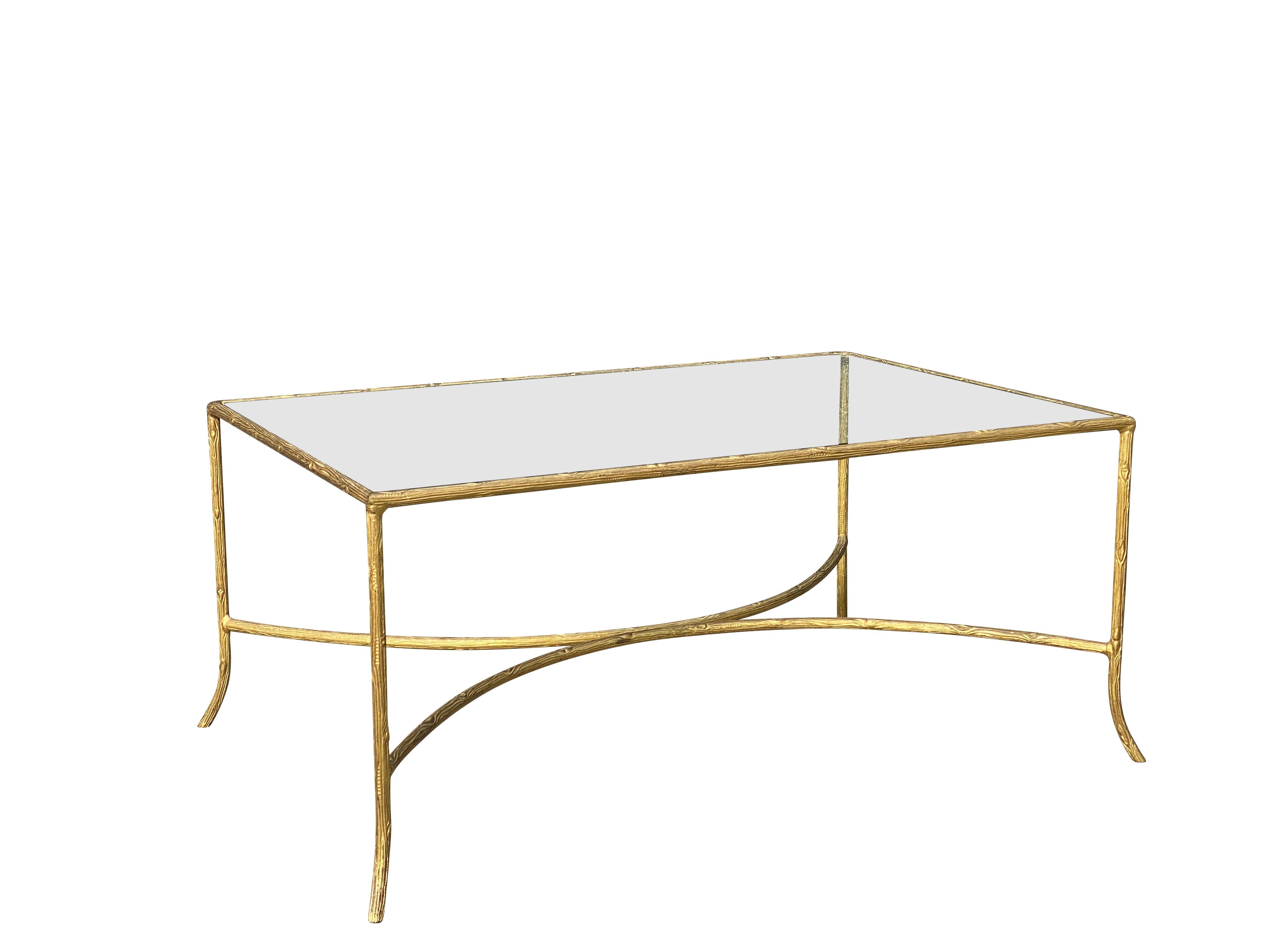 Rectangular glass top set in a cast faux bois frame, conforming legs and reverse C-stretcher.