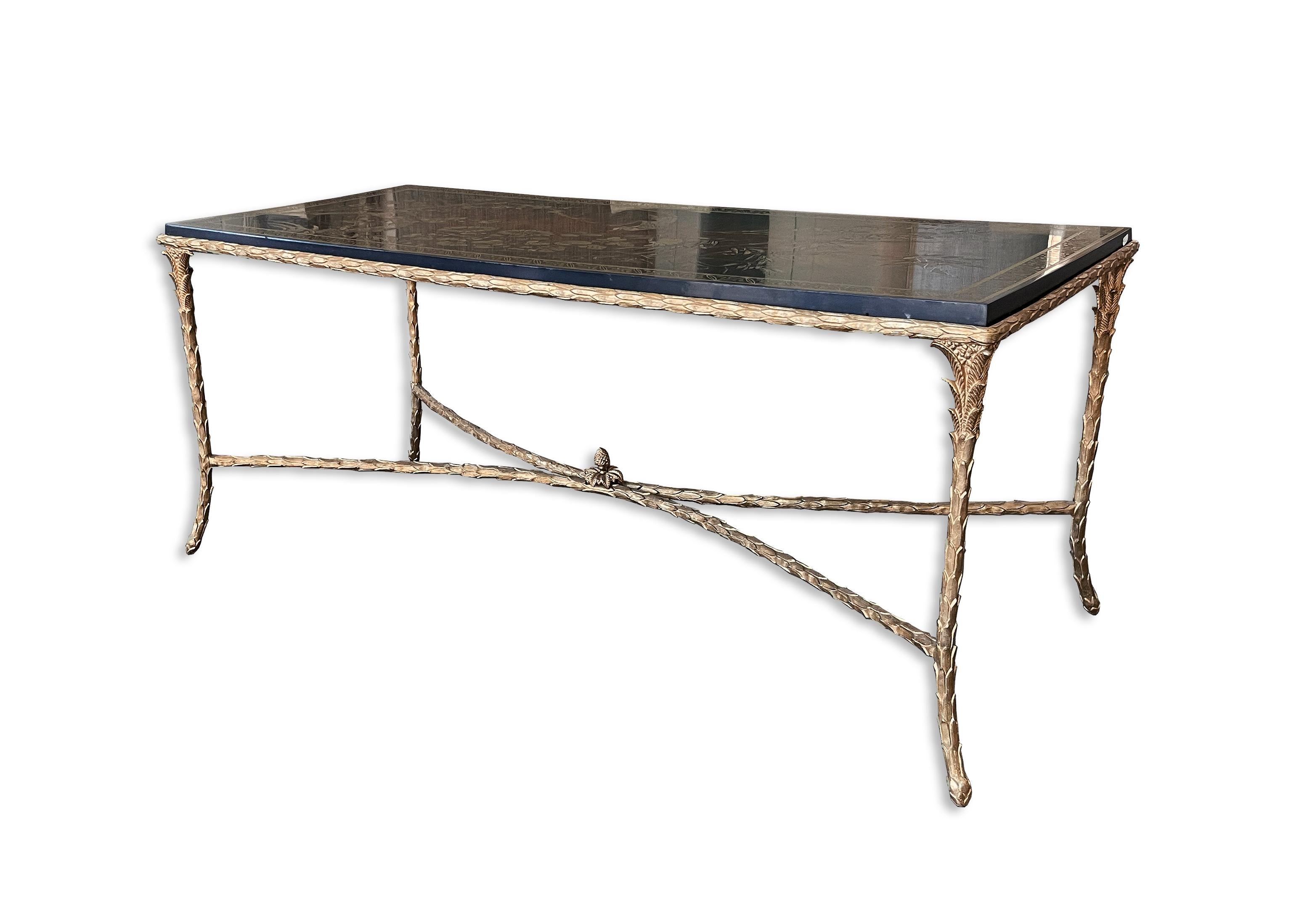 Maison Charles, Circa 1960,s

This very elegant Maison Charles coffee table is in its original condition; It has a gilt bronze, palm trunk motif frame and a beautiful dark brown lacquered top with a Asian decor of a bird on a branch. The feet on