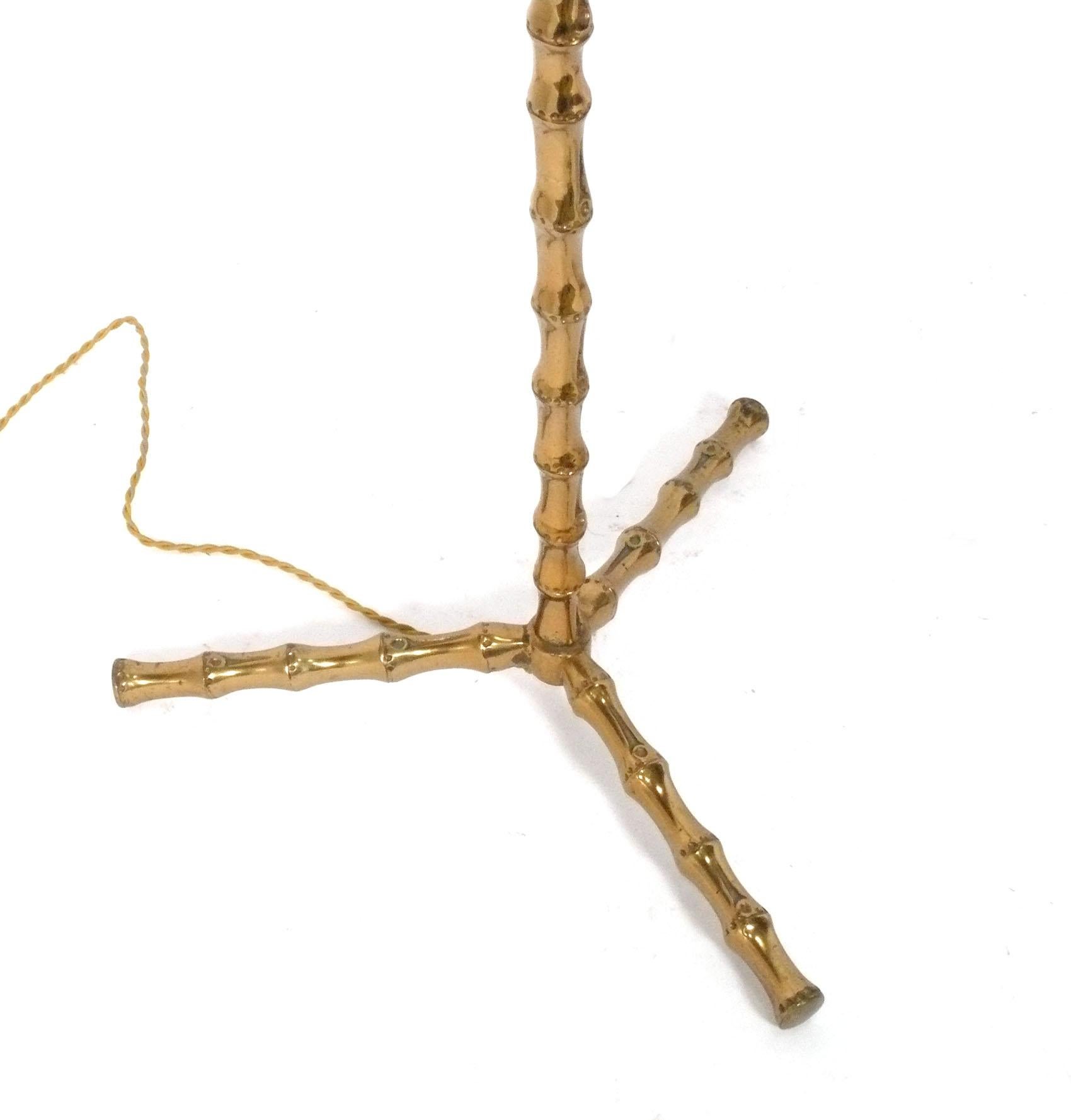 Glamorous Bronze Faux Bamboo Floor Lamps, by Maison Bagues, France, circa 1960s. They have been rewired and are ready to use. The height to the tops of the sockets is 60