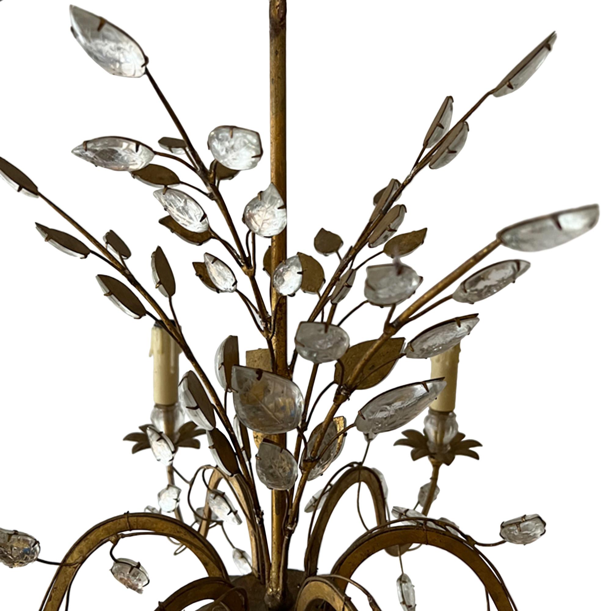 Wonderfully elegant mid 20th century gilt metal and crystal chandelier by Maison Baguès. Made in Paris in the 1950s.

Since the 1860s, the renowned French luxury lighting atelier Maison Baguès has been producing pieces that are highly valued