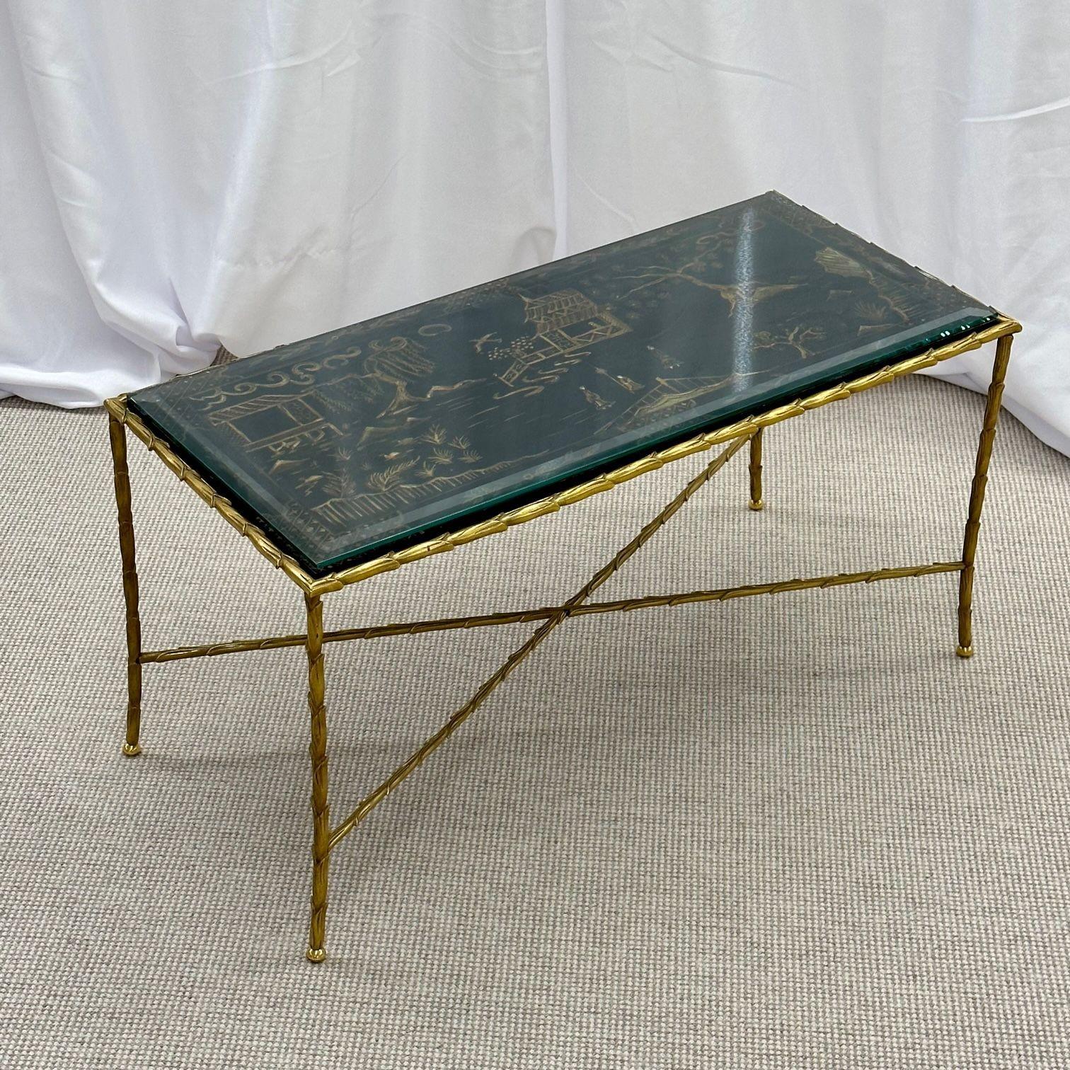 Maison Bagues coffee cocktail table, black japanned lacquer gilt metal low table.

Finest quality Bagues Japanned coffee or cocktail table having a lacquered Chinoiserie table top depicting raised figural scenes including houses, huts, trees and