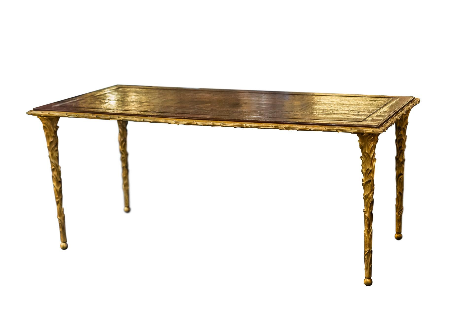 Maison Baguès,
Coffee table,
Gilt bronze, palm-shaped feet,
Lacquered wood tabletop (Coromandel lacquer),
France, circa 1970.

Measures: Width 103 cm, depth 54 cm, height 43 cm.