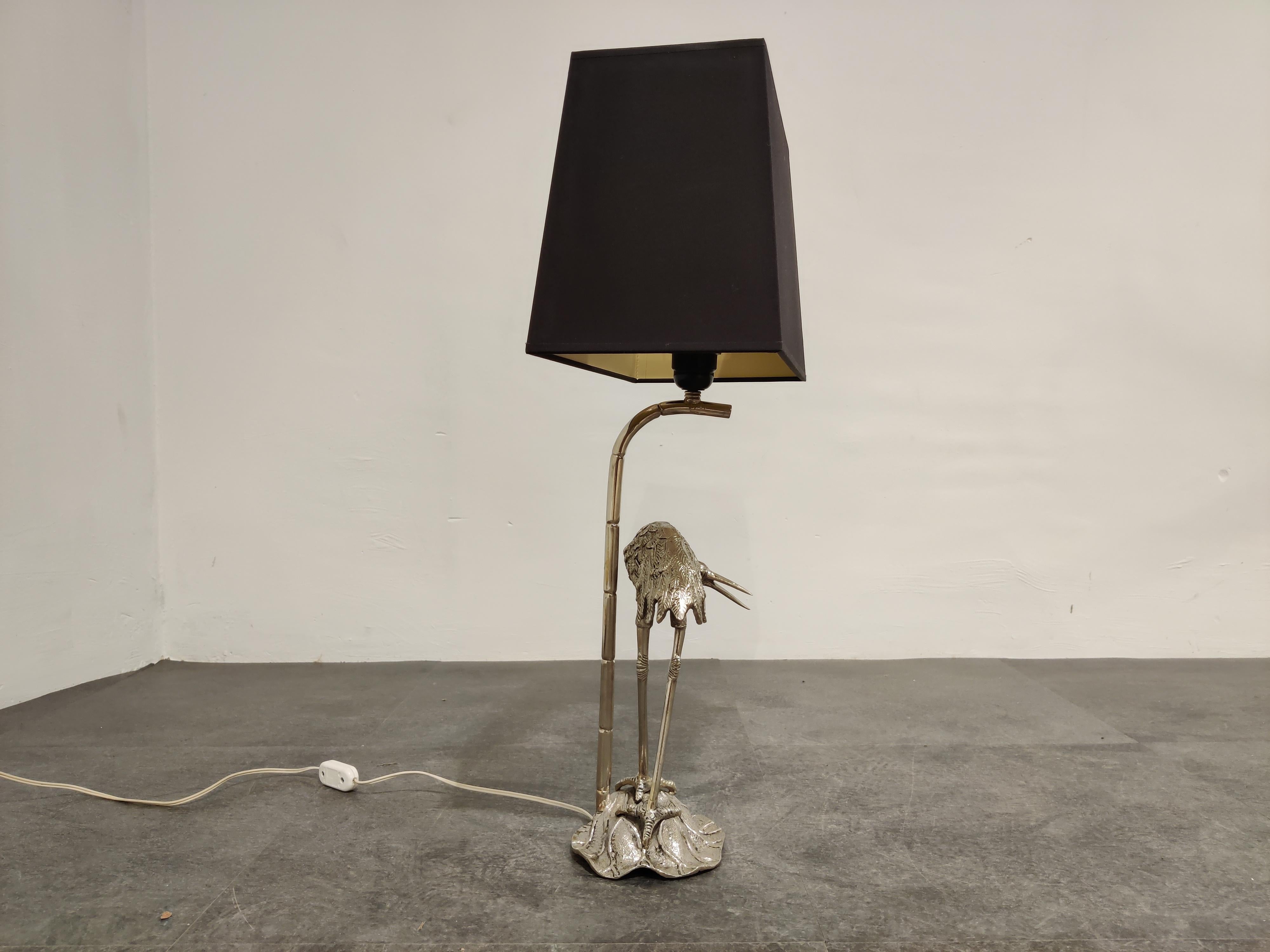 Beautiful crane bird or Héron table lamp by Maison Baguès.

Beautifully detailed silvered crane bird sculpture with a faux bamboo metal rod supporting the lamp and light shade.

New lamp shade creating a warm light.

Tested and ready for use