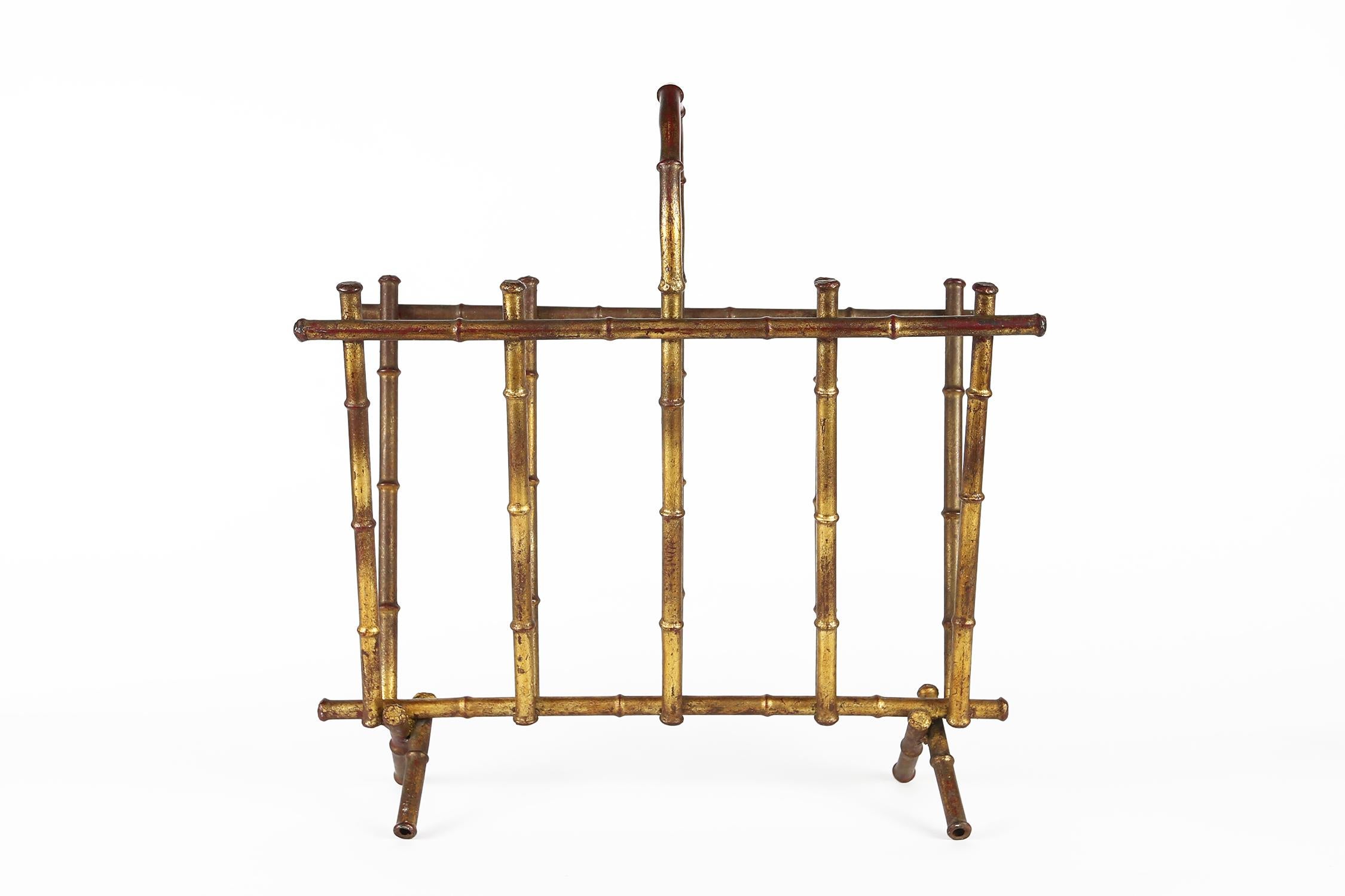 This vintage Baguès magazine holder is made in France, circa 1950, the elegant, midcentury magazine holder is both useful and stylish. The rack has a popular faux bamboo design with wonderful, clean lines and a modern, neoclassical sensibility. The