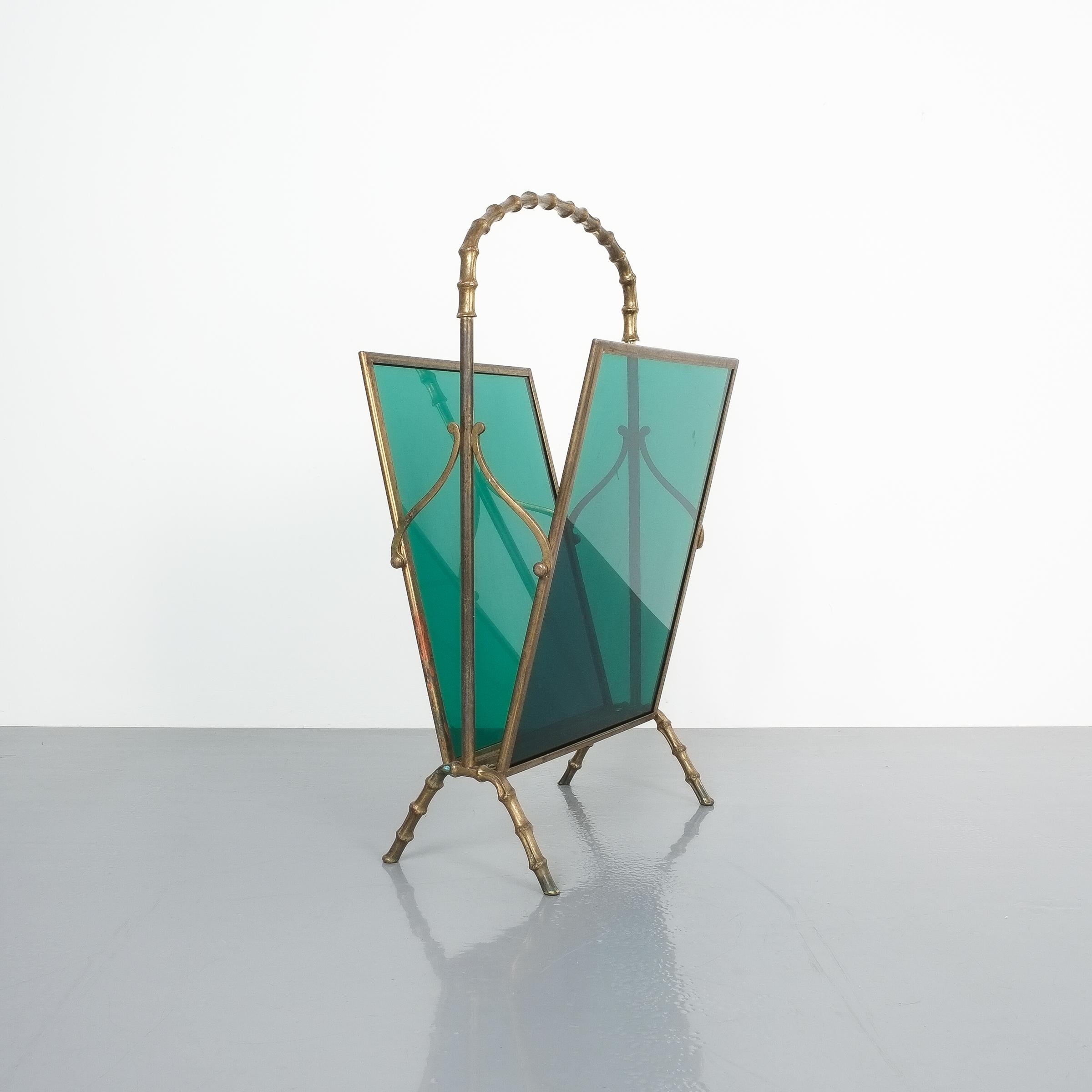 Maison Baguès attributed faux bamboo green Lucite magazine rack. Delicate magazine rack comprised of brass and green Lucite panels. The rack is in good condition with some patina to the brass.