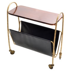 Maison Baguès, portariviste francese in bronzo, pelle e legno laminato con rotelle