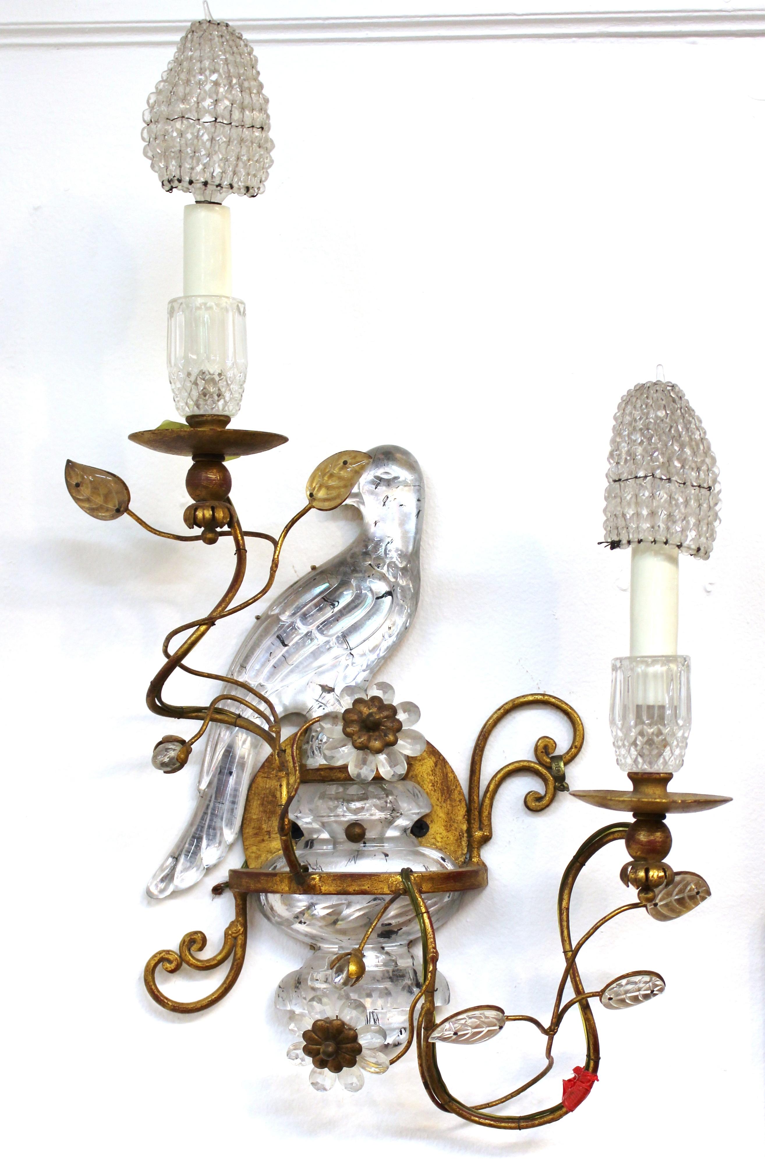 Maison Baguès French pair of sconces with rock crystal birds and foliage on brass frames. The pair comes with beaded crystal covers for the light bulbs and is in great vintage condition.