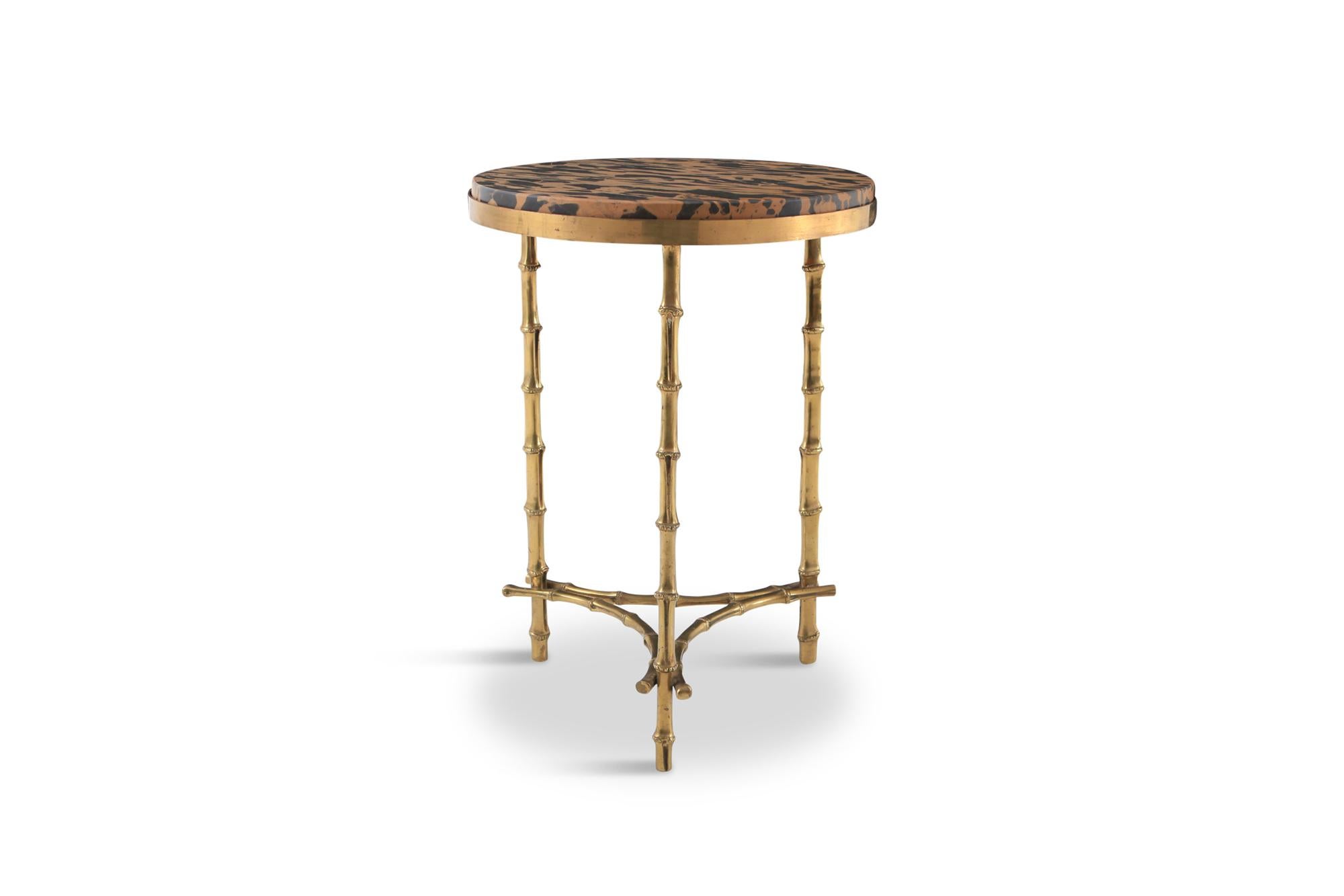 Mid-Century Modern brass bamboo side table by Maison Baguès, France, 1970s
Leopard like marble top.

Stunning piece that fits well in an eclectic Hollywood Regency inspired metropolitan interior.
