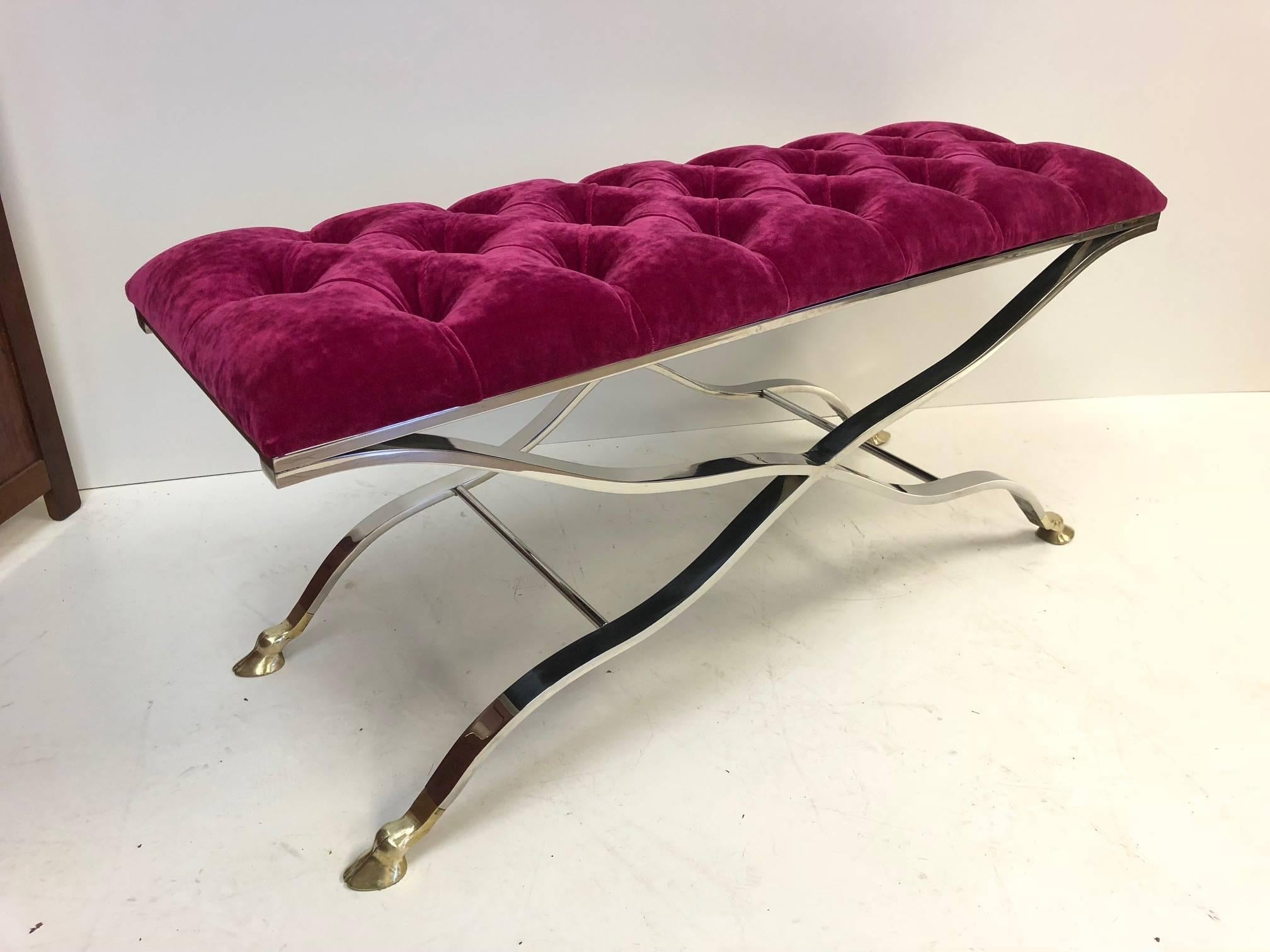 Maison Baguès iron and bronze tufted bench. Base is steel with brass hoof feet. Newly upholstered in mohair fabric.