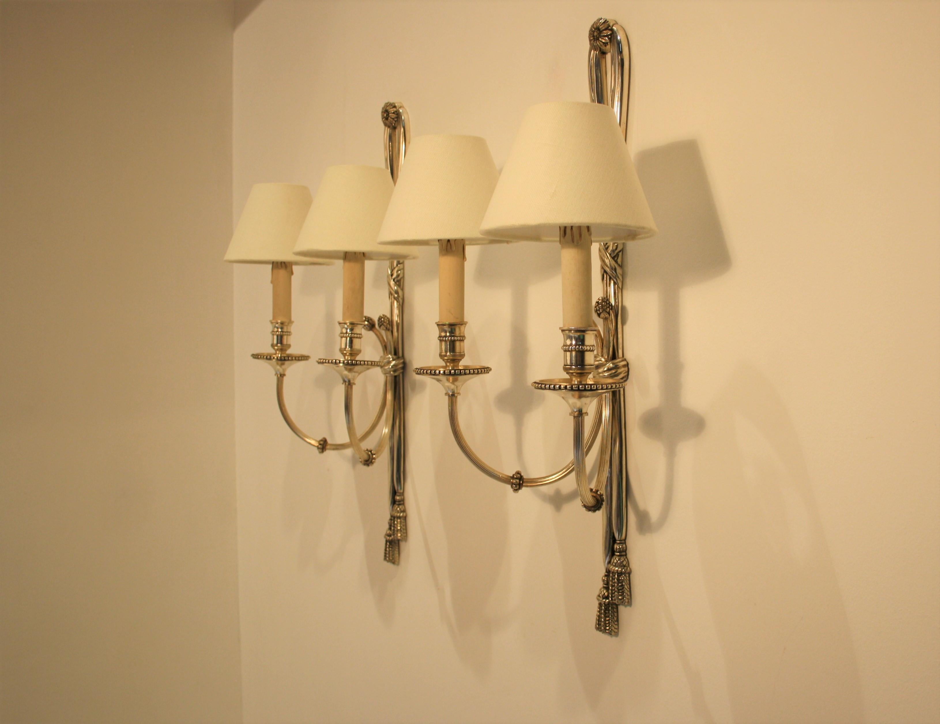 A pair of very fine cast silvered bronze sconces from the famous Maison Baguès in Paris in a very simple but stylish Louis XVI style.
Baguès was started in Auvergne, circa 1840. Initially specialized in liturgical bronze, the company developed at