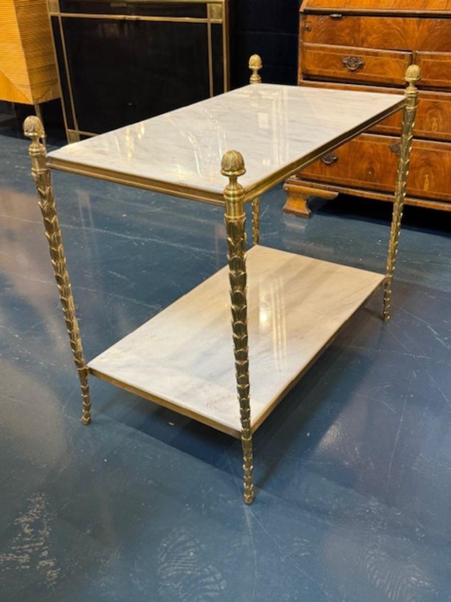 Maison Bagues manner gilt bronze and Carrara marble side table. You're eyeing a piece that radiates refined glamour—Maison Baguès–manner gilt bronze and Carrara marble side tables are a masterclass in French decorative arts. These tables are perfect