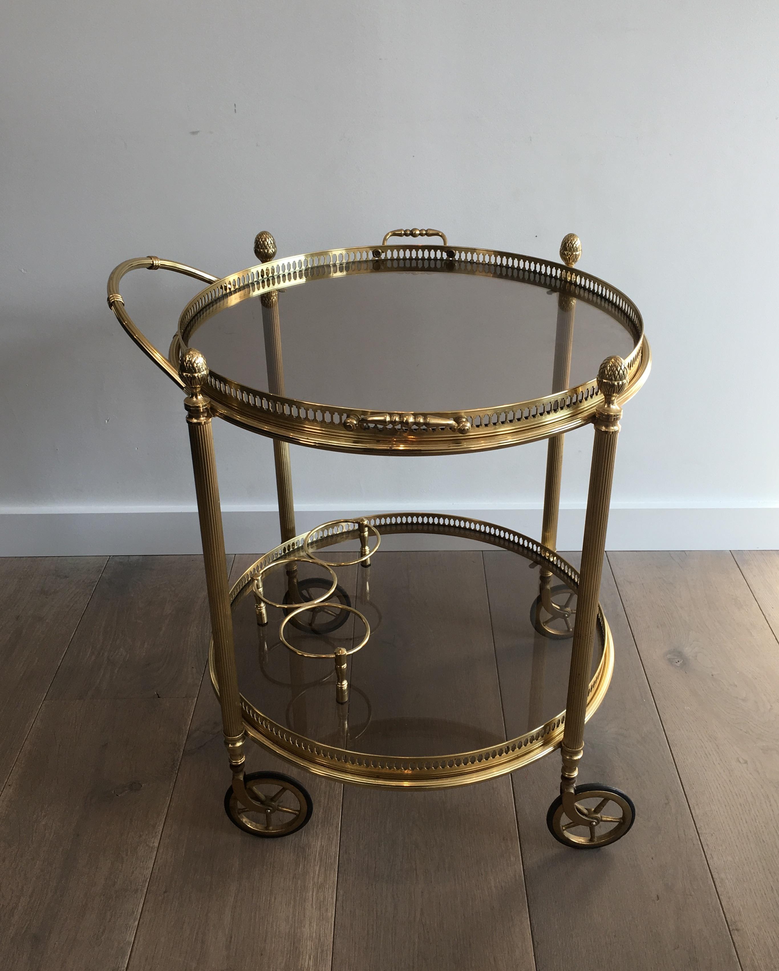 Maison Bagués. Neoclassical round brass drinks trolley. Smoked glass. French, circa 1940.
Smoked glass can be replaced for clear glass (quote on request).