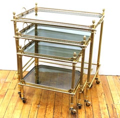 Maison Baguès Nesting Tables in Brass and Smoked Glass on Casters