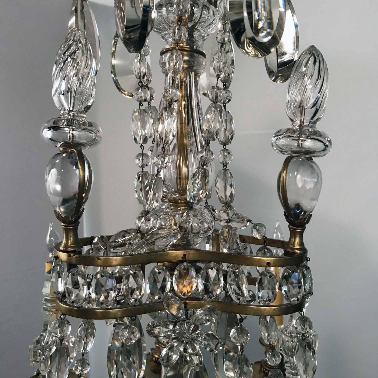 Bronzo Lampadario a nove bracci in bronzo e cristallo della Maison Baguès in vendita