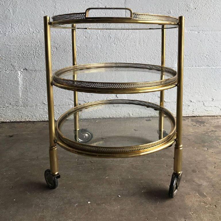 Superb Maison Bagues three-tier bar cart. Three trays are removable Very high quality brass and bronze.