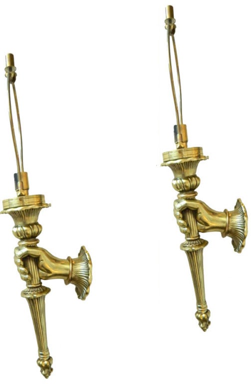 Pair of heavy and solid bronze wall sconces by Maison Baguès featuring a hand holding a torch.
3 sconces available. Priced for 1 pair.
22 inches H with the harp.
US wired and in working condition.
Have a look on our impressive collection of French