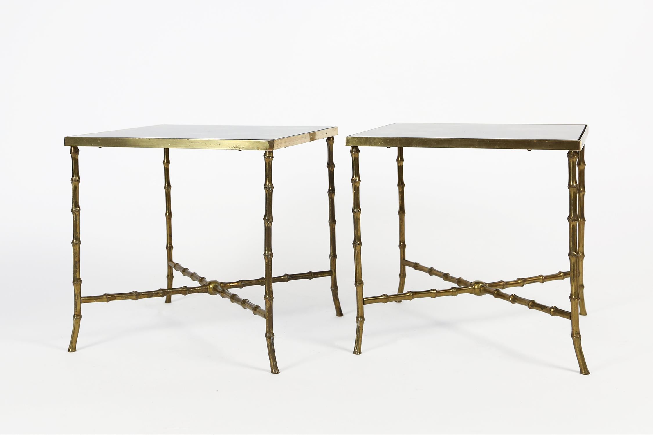 A rare pair of sidetables in faux bamboo brass from Maison Baguès.
These tables can be dated circa 1955 and are finely cast in brass and are adorned with original patinated glass tops.
The look is Classic, timeless and always sophisticated.
In