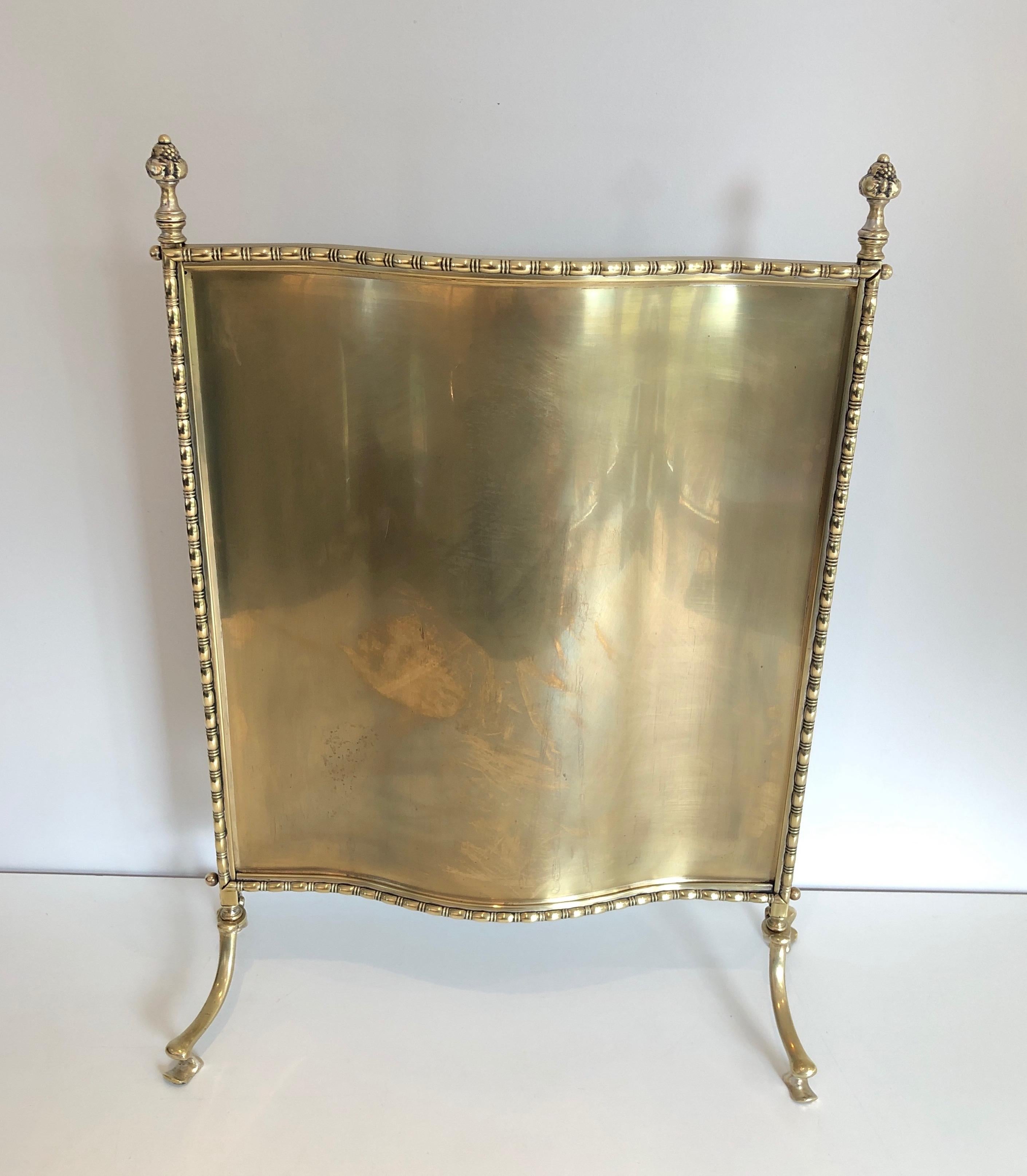 This very nice and rare neoclassical style fire place screen is made of bronze, steel and brass with faux bamboo decor and finials. This is a very nice work by famous French designer Maison Bagués, circa 1940.
