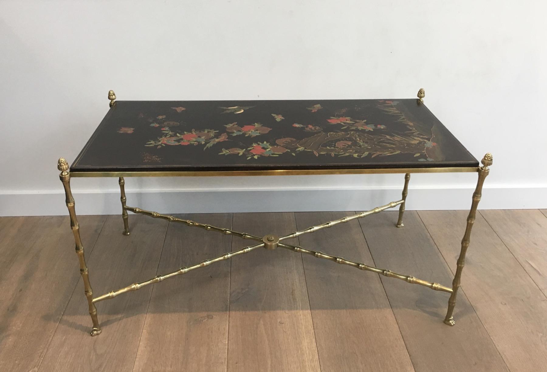 Maison Bagués. Rare Neoclassical Bronze Coffee Table with Faux-Bamboo and Claw Feet Base. Lacquered Wood Top with Chinoiseries. Beautiful Piece. French. Circa 1940