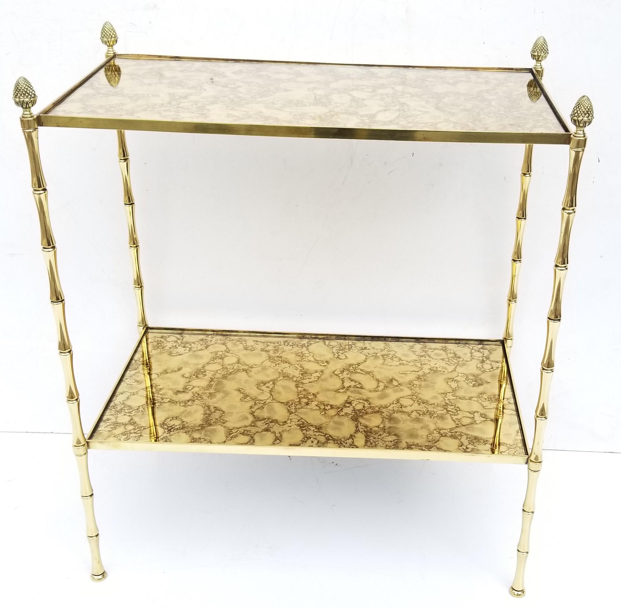 Maison Bagues rectangular side table
2 tiers, 1st tiers height: 8 in
Bronze ans brass, gold cloudy mirror.