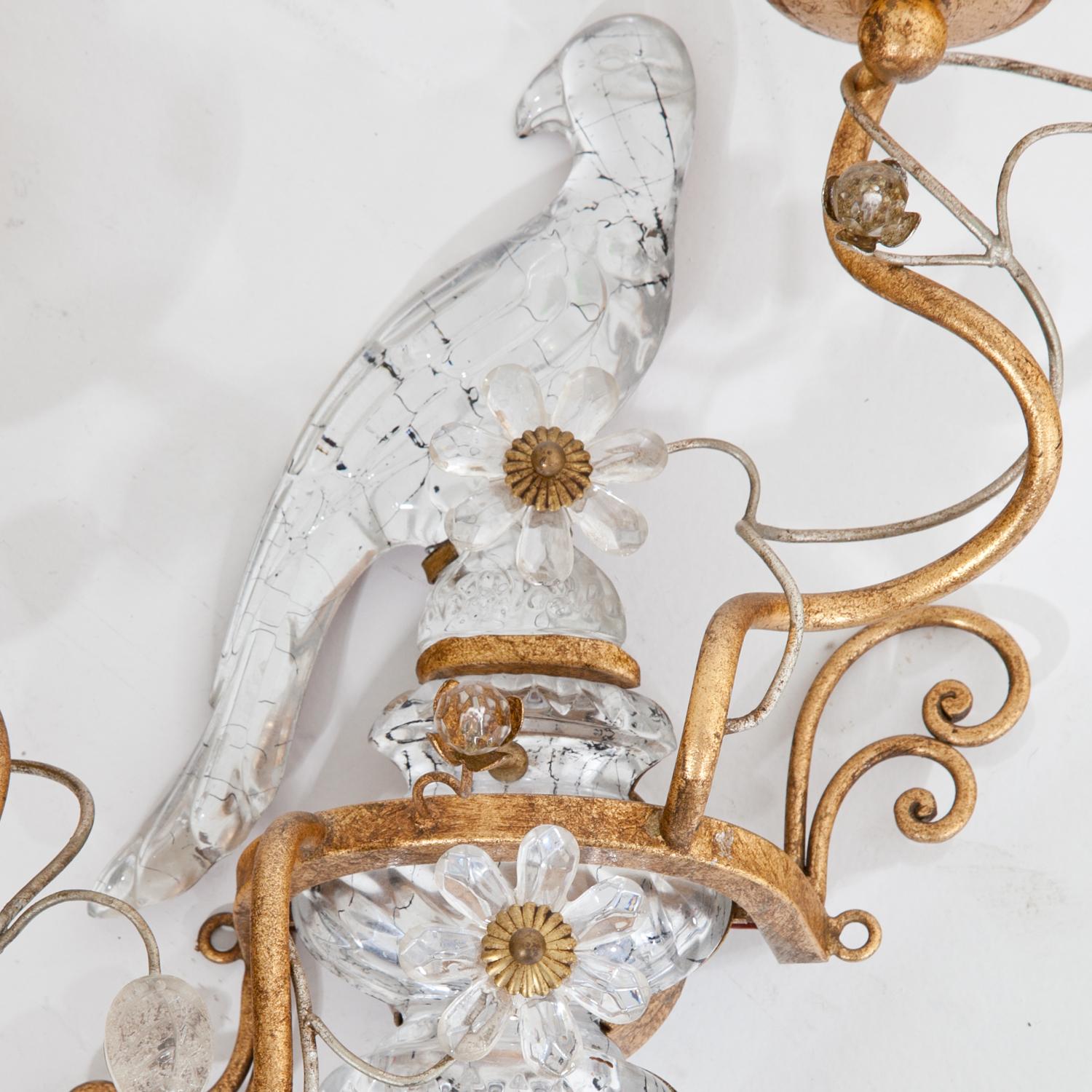 Pair of French two-light sconces with bird décor and wound gilt arms, decorated with glass leaves and flowers by Maison Baguès.