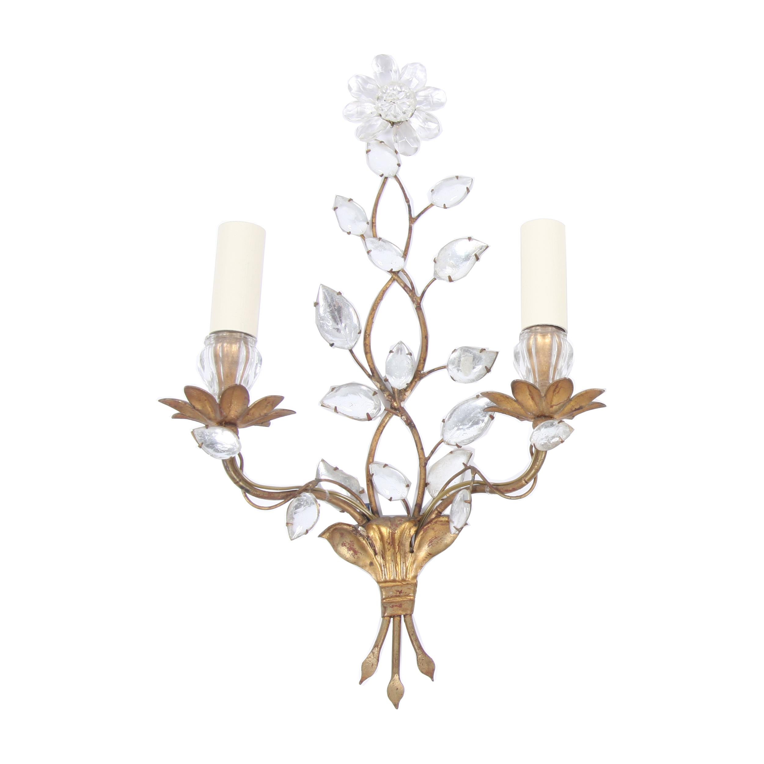 This is a lovely pair of wall sconces from Maison Baguès. Made from gilt metal and glass, with a flower design.

Made in France in the 1950s. Gorgeous!

Since the 1860s, the renowned French luxury lighting atelier Maison Baguès has been