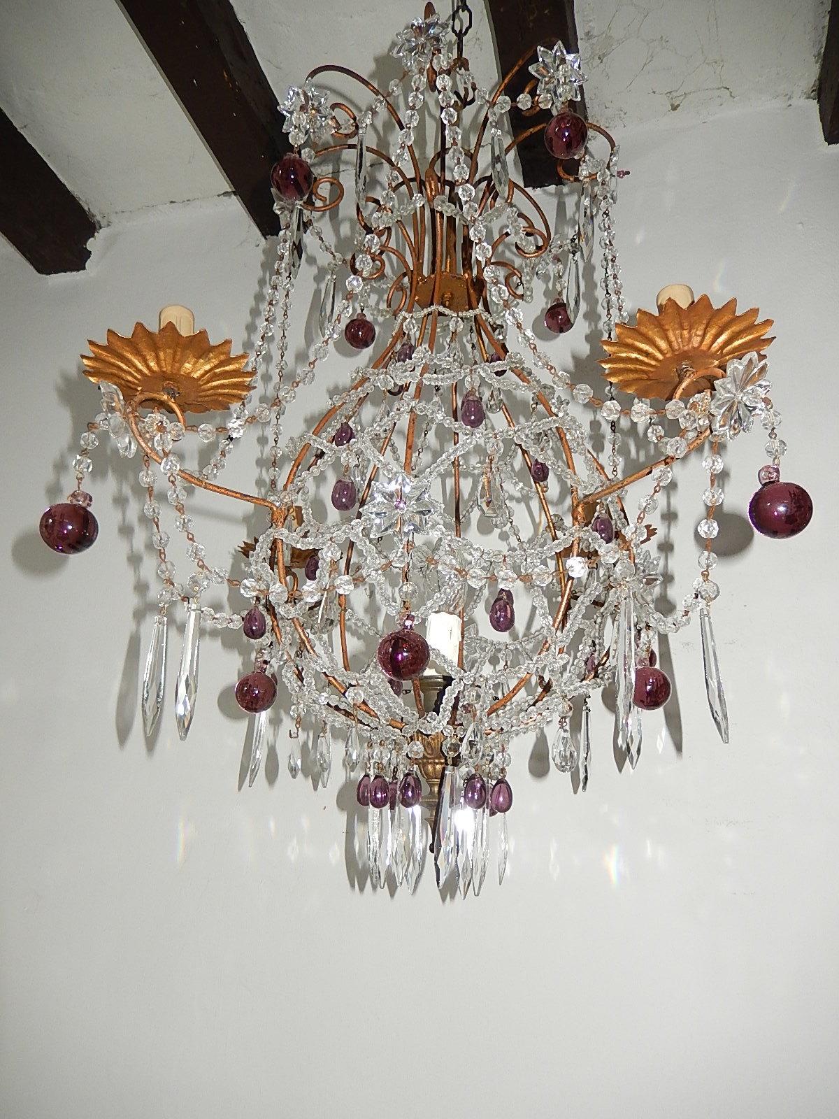Housing 5 lights, 4 encircling and one inside. Criss-cross beading with swags of crystal beads. Adorning crystal prisms and amethyst Murano drops. Will be newly rewired with certified US UL sockets for the Usa and appropriate sockets for all other