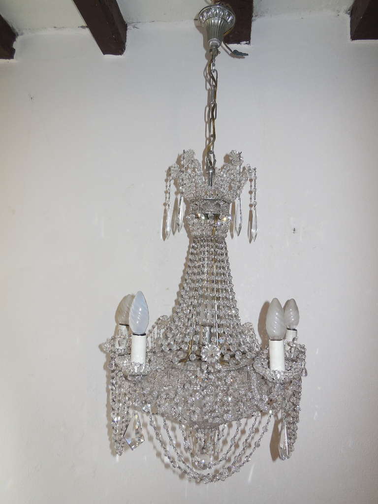 Housing 5 lights. Will be newly rewired with certified US UL sockets for the USA and appropriate sockets for all other countries.  Bulb holders are even beaded on the outside! Just dripping with crystals! All intact and in great shape. Adding