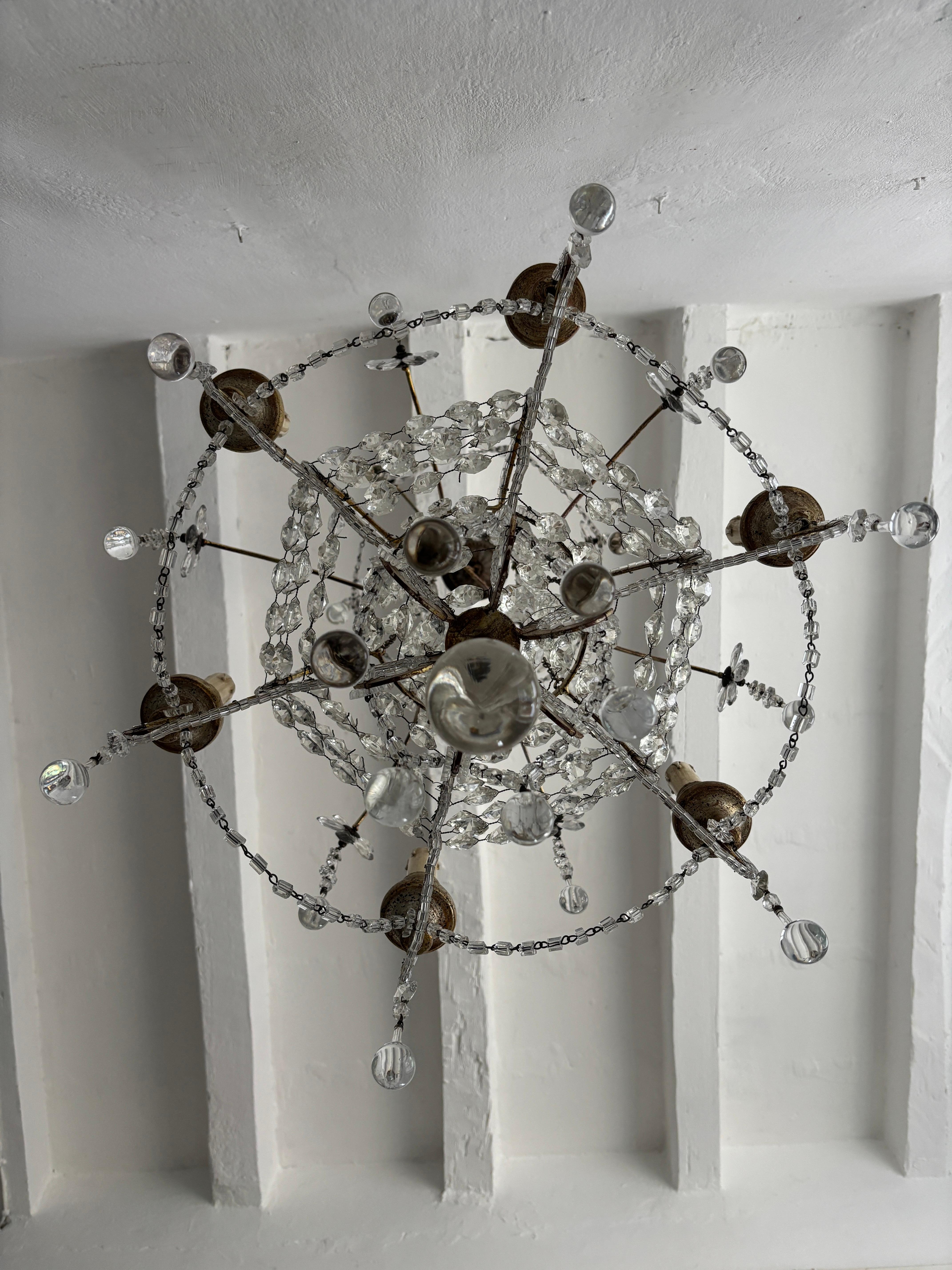 Housing 6 lights, sitting in silver and gold color wood bulb holders. Will be newly rewired with certified US UL socket for the USA and appropriate socket for all other countries and ready to hang. Adorning crystl prism flowers springing out from