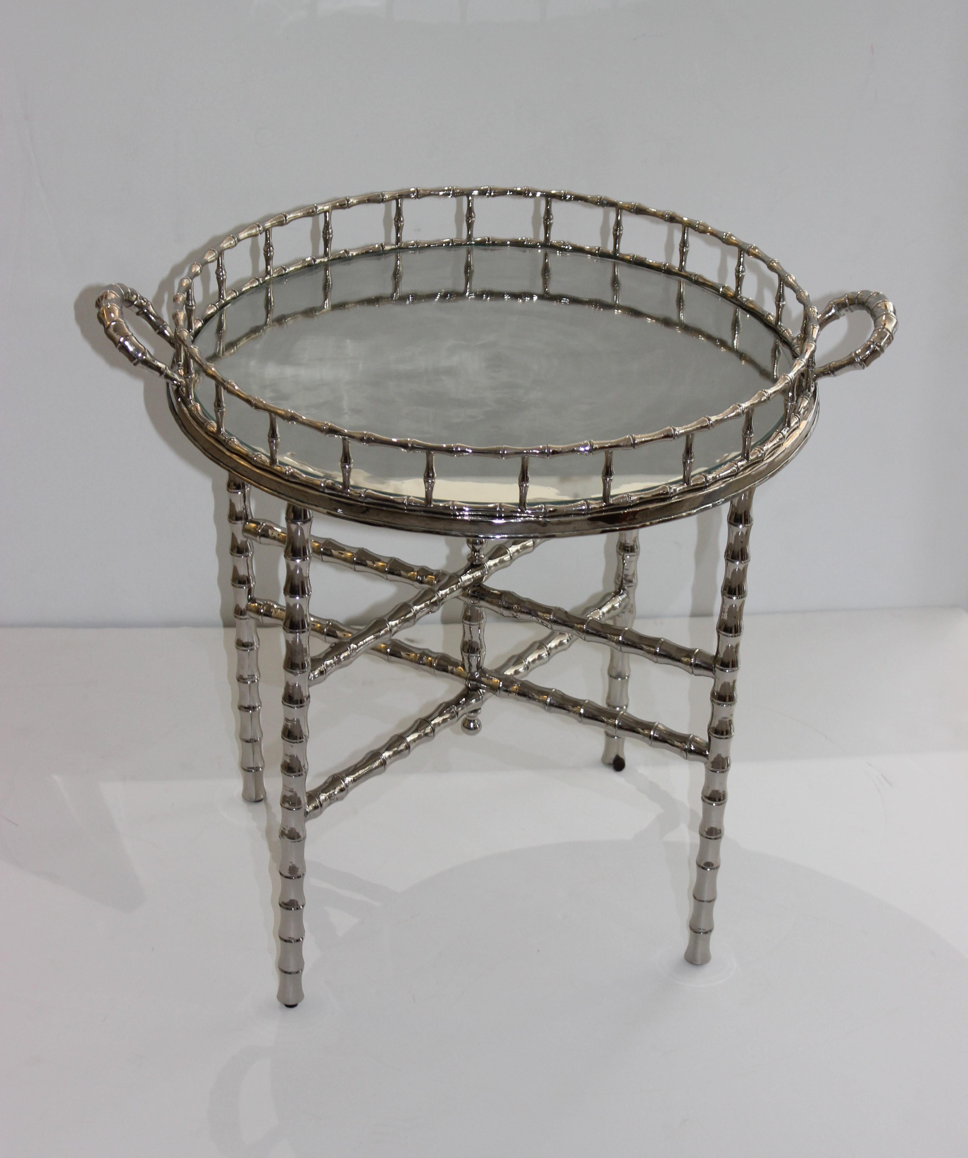 This stylish and chic Maison Baguès style faux bamboo tray table was acquired from a Palm Beach estate and it has been recently (2020) nickel-plated to give the piece a modern and fresh look.