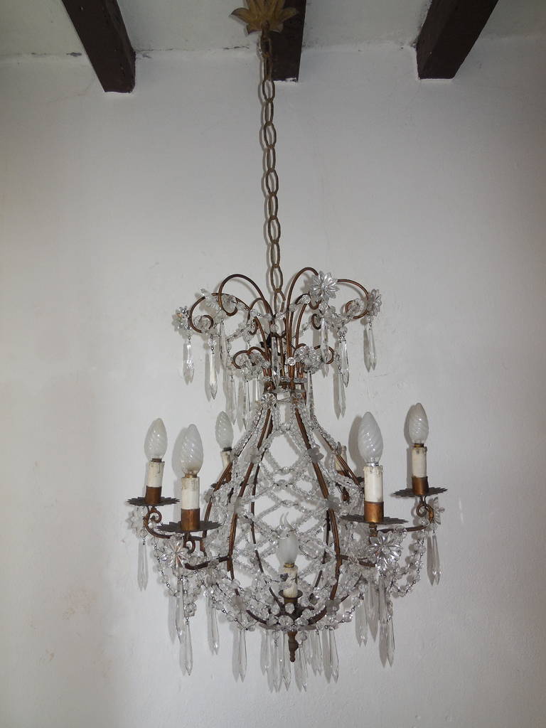 Housing an impressive 7 lights. Stars, balls, spars and flowers are all in crystal. Criss-cross beading. Flower florets, extremely rare. Adding 22 inches of original chain and canopy. Re-wired and ready to hang! Free priority shipping from Italy.
