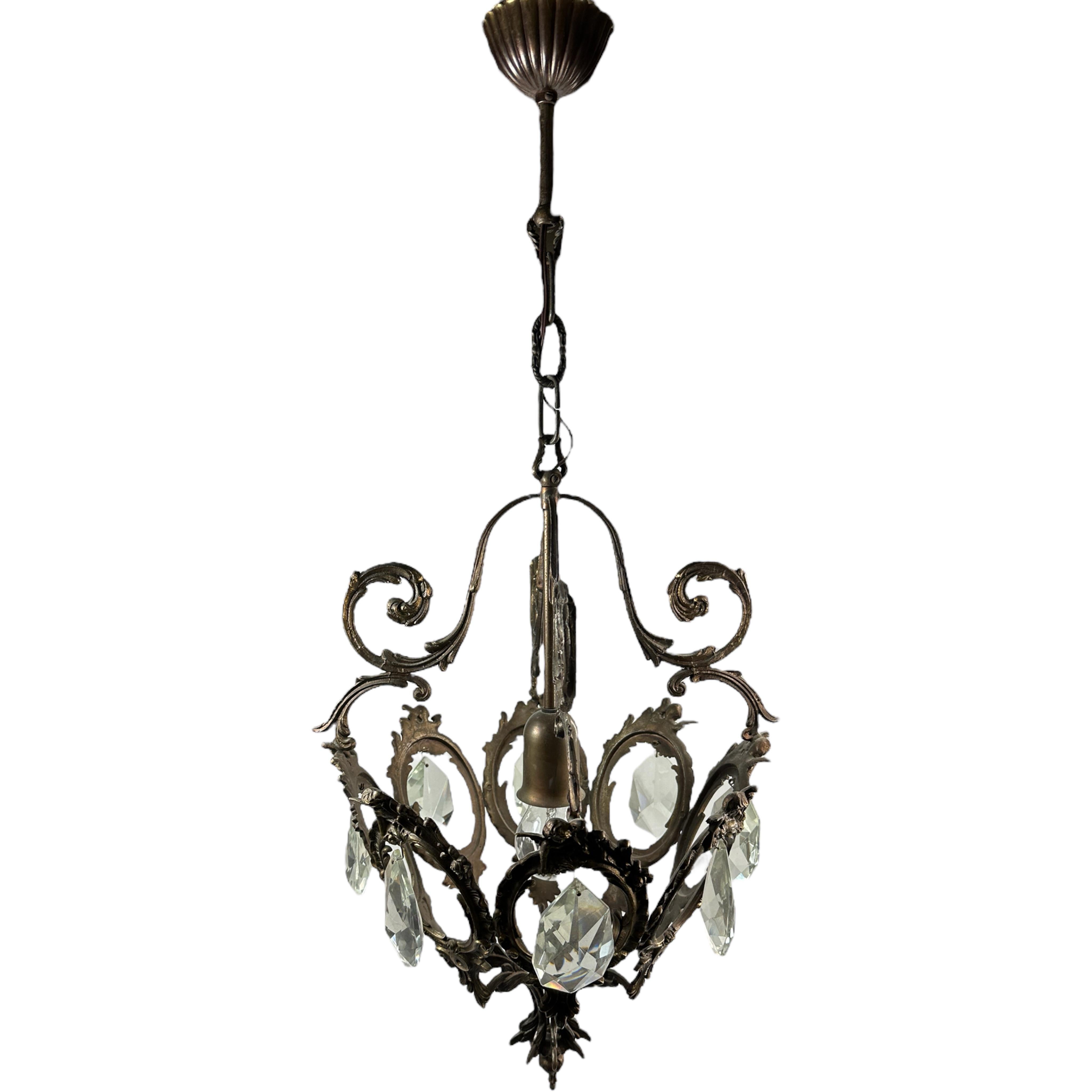 A beautiful iron and crystal lantern chandelier in the style of the prestigious Maison Baguès.
One light handmade bronzed metal with crystal stones, beautiful piece of art.
The Fixture requires one European E27 / 110 Volt Edison bulb, up to 60