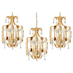"Maison Baguès", tre grandi ed eleganti lanterne in metallo dorato e argentato, 1950