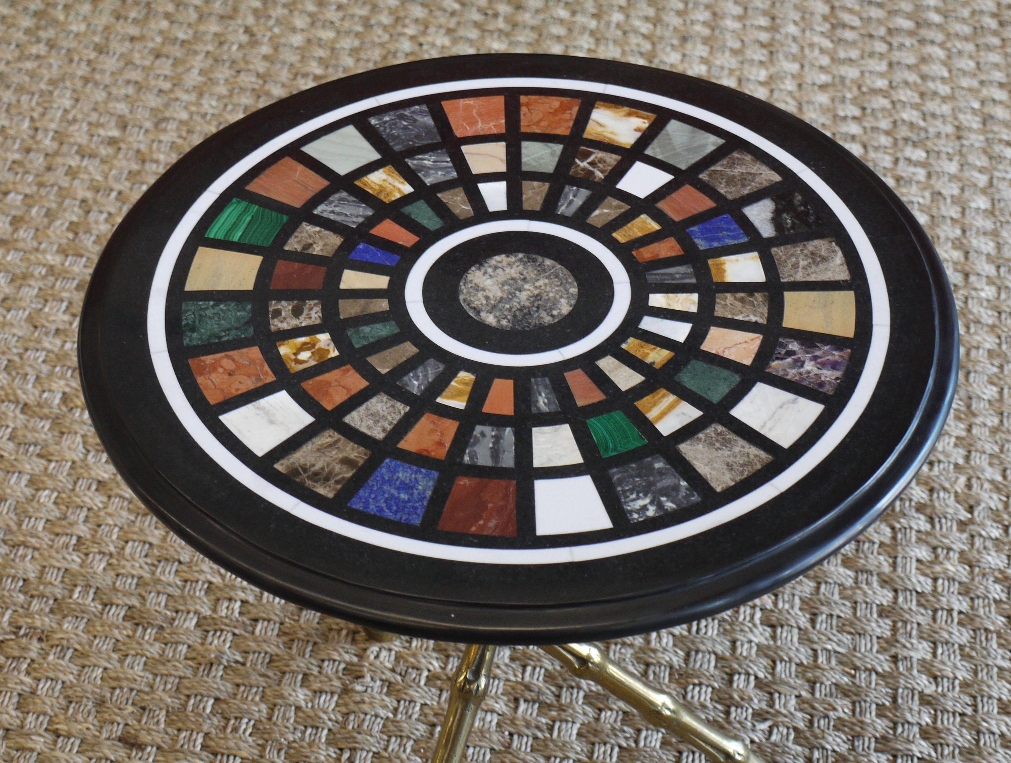 Spectacular 1950s bronze faux bamboo tripod table with a pietra dura specimen marble top featuring various semi precious stones, lapis, onyx, malachite, amethyst and various others.