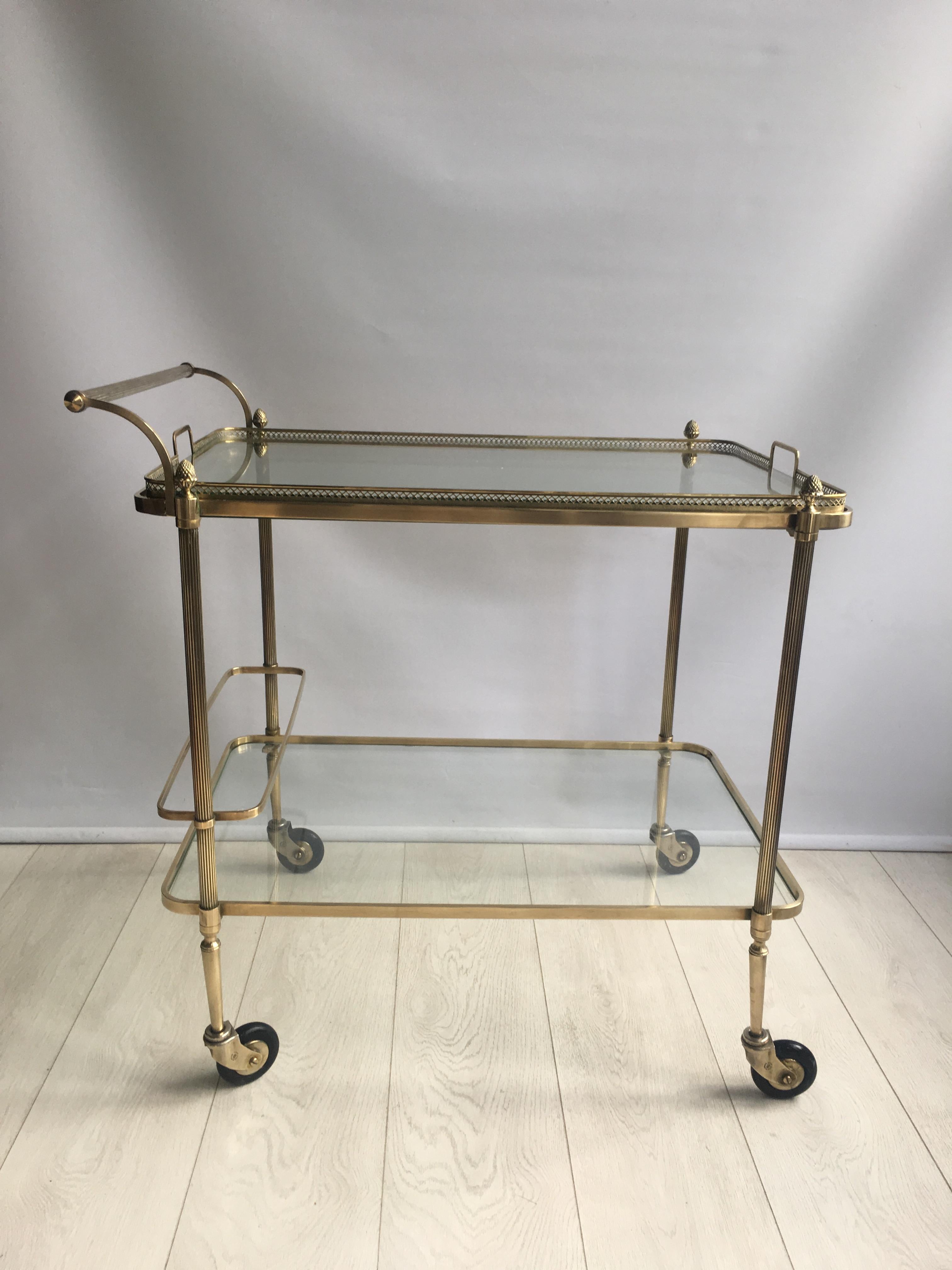 Superb quality drinks trolley attributed to Maison Baguès.

Polished brass frame with lift off top tray measuring 70cm by 45.5cm 

Measures: Overall dims 75cm wide, 51cm deep and 76.5cm tall (67.5cm to glass).