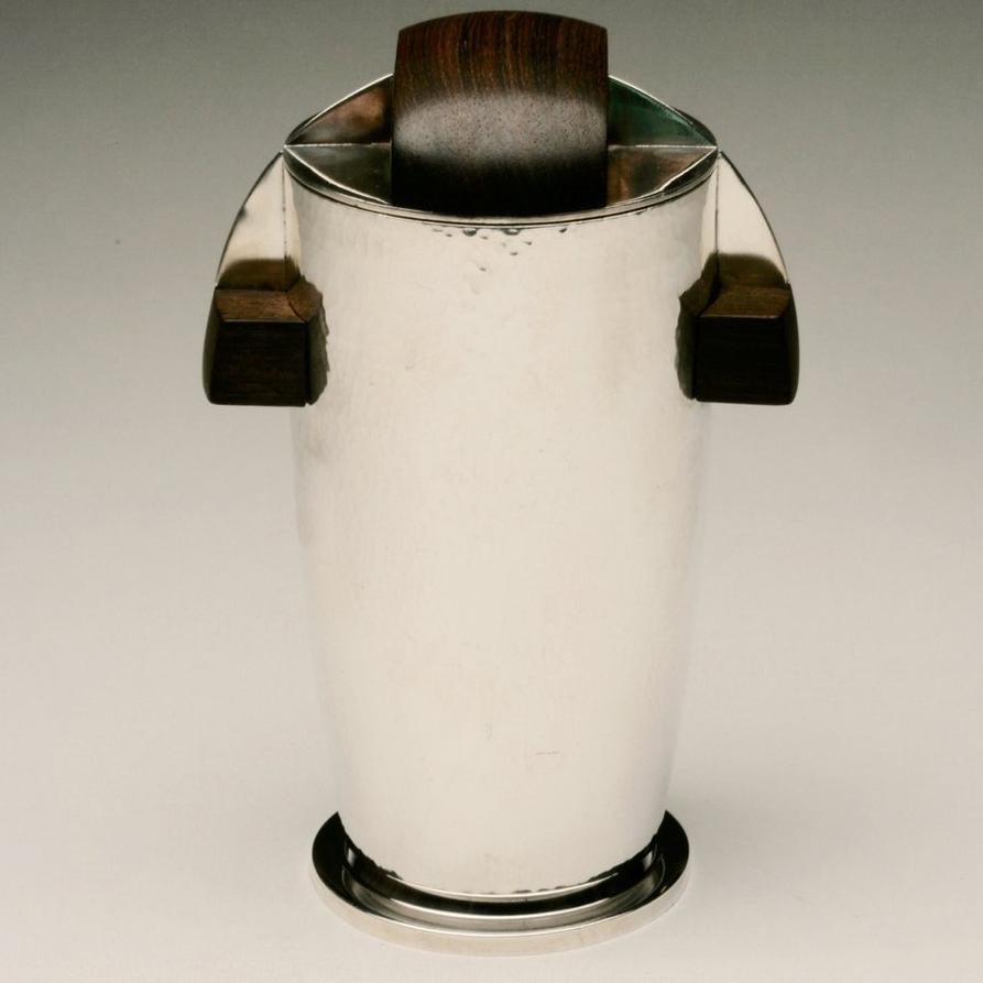 Maison Bloch Eschwege .950 Silver and wood Art Deco cocktail Shaker/urn.

Retailed via New York luxury retailer Chatillon Co., Inc.

Maker: Maison Bloch Eschwege

Circa: 1921-46 

Dimensions: 8