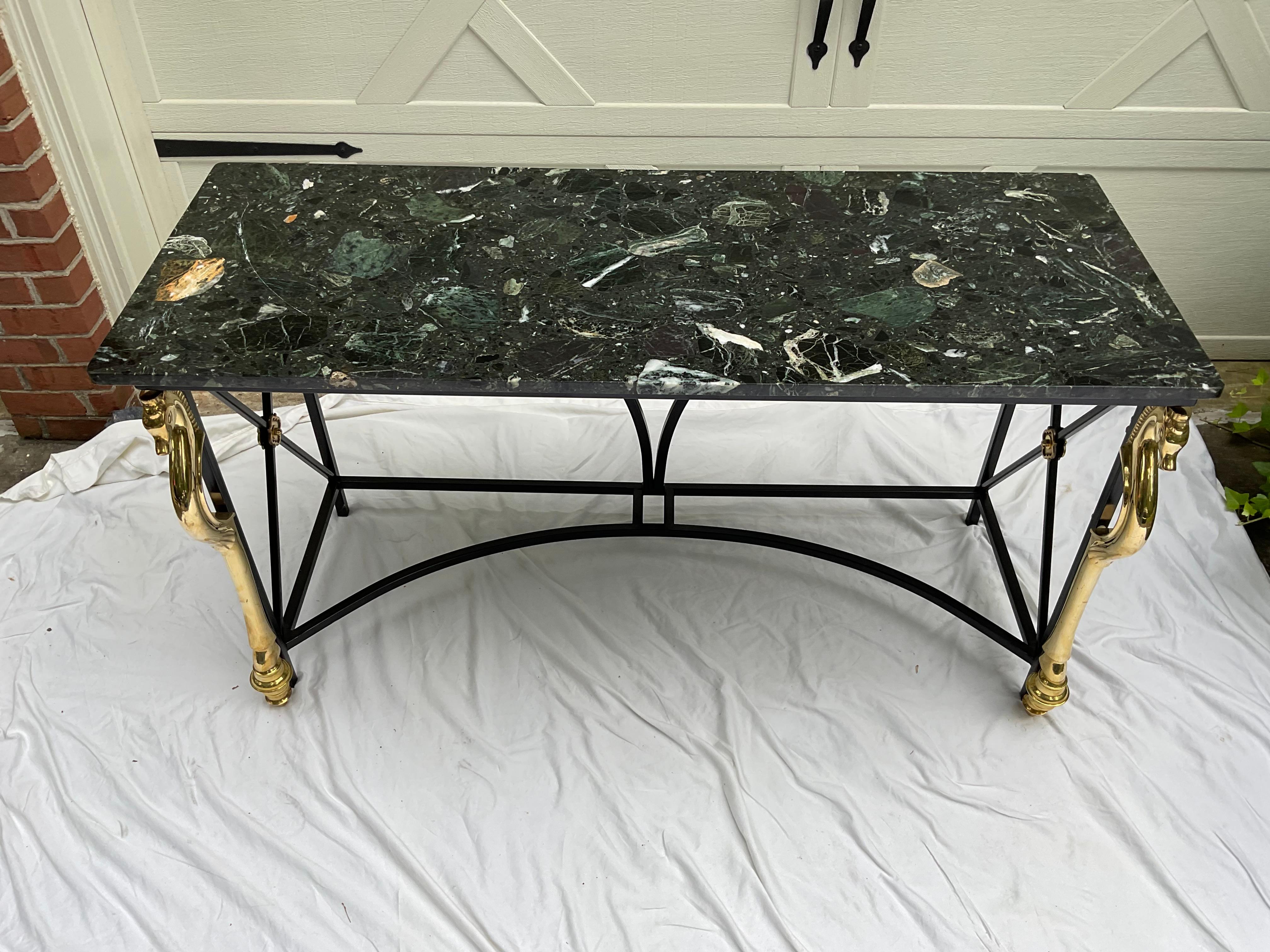 Striking console table, attr. to Maison Charles.  Black steel base, with brass equestrian style accents.  The black base has been repainted, and the brass has been cleaned. Regency style at its best!    I am not a  professional photographer, so