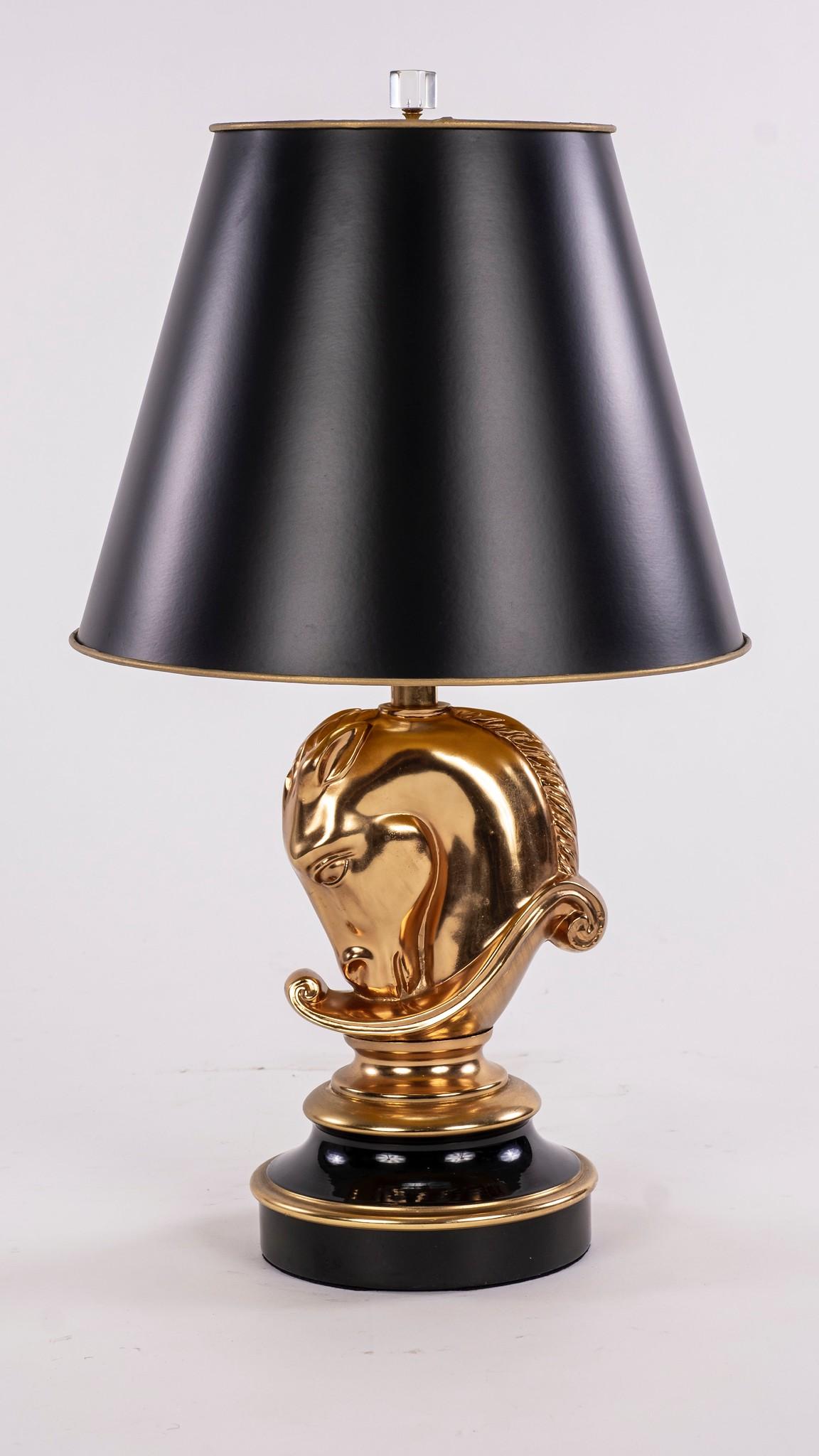Early 20th century gilt horse head ceramic lamp with black shade. Newly electrified.