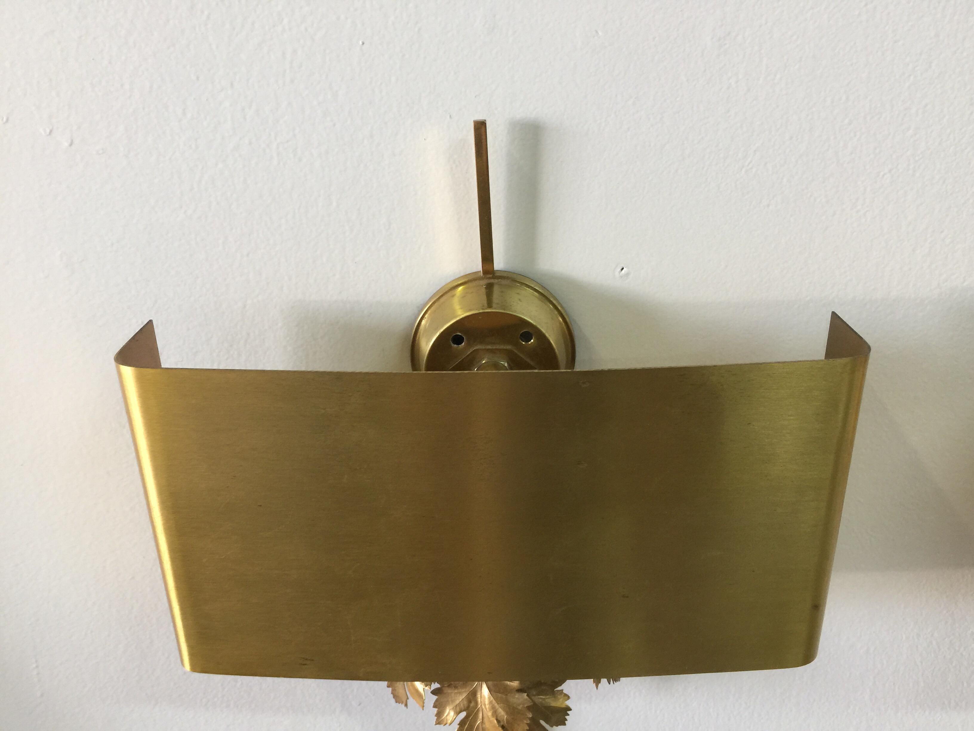 A very beautiful pair of all brass wall sconces by Maison Charles. All original shade, leaves, etc. Very nice scale and original wiring.