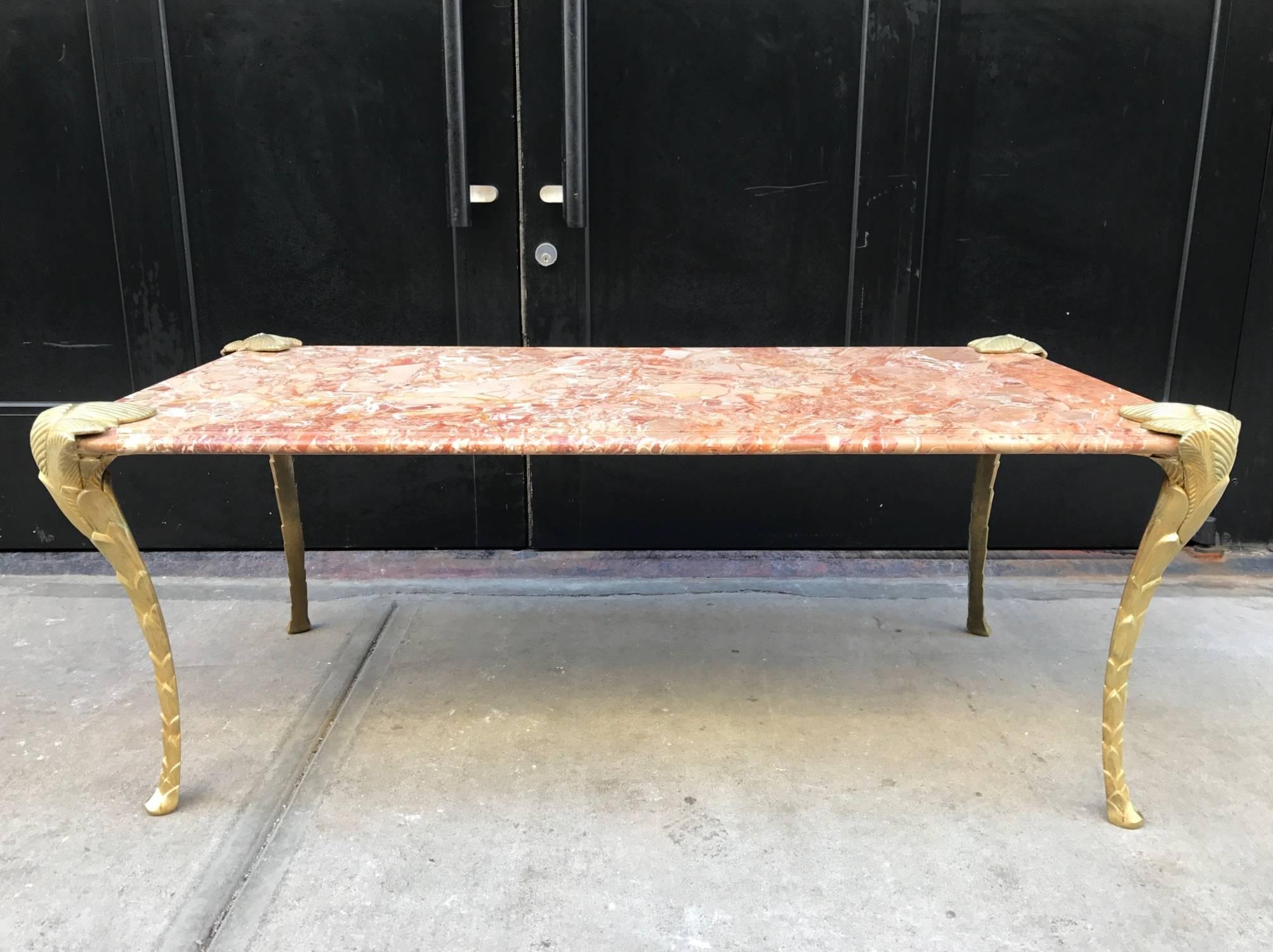 French bronze and marble coffee table. The table has a marble top with floral style bronze legs. Stamped made in France under one of the legs.