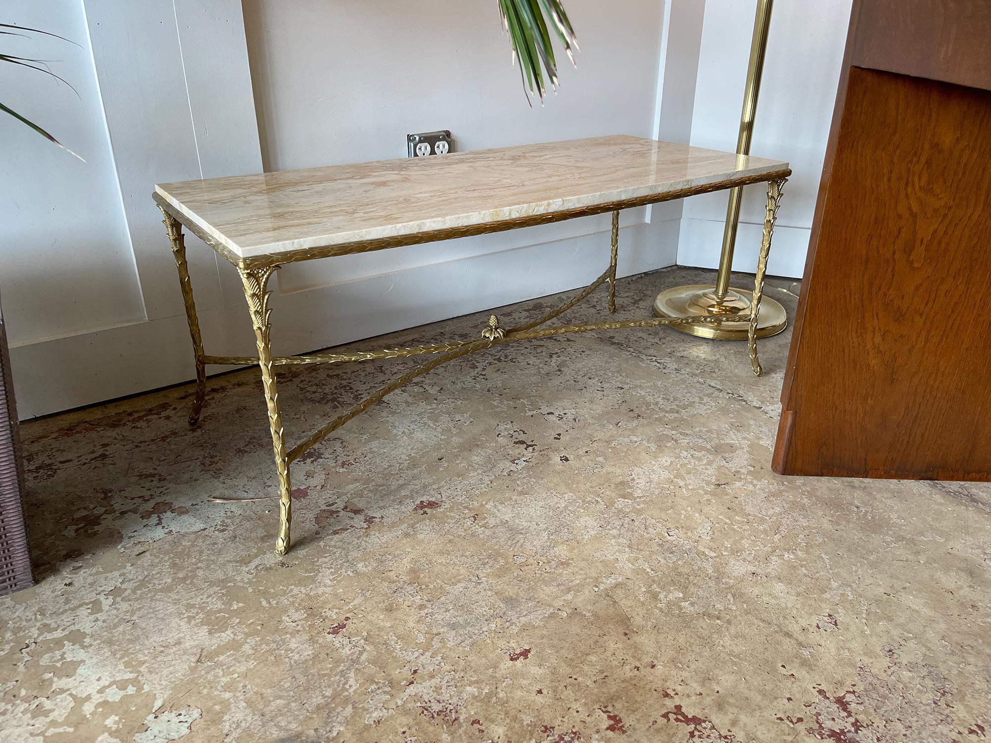 Maison Charles, circa 1960s

This very elegant Maison Charles coffee table is in its original condition; It has a gilt bronze, palm trunk motif frame and a beautiful dark brown lacquered top with a Asian decor of a bird on a branch. The feet on