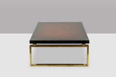 Maison Charles. Couchtisch aus Bronze mit lackierter Platte. Circa 1970.