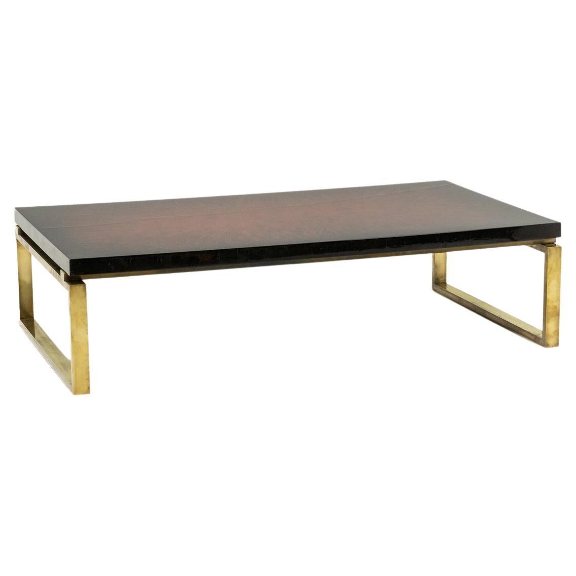 Maison Charles. Table basse en bronze avec plateau laqué. Circa 1970.
