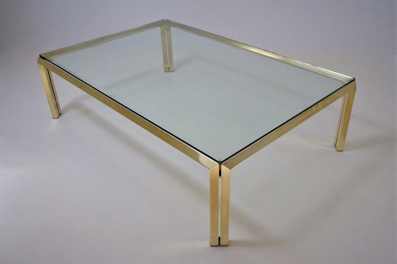 Maison Charles by Philippe Parent (attributed), large brass coffee table, 1970s, French.

This coffee table has been gently cleaned while respecting the vintage patina. It is ready to use.

This vintage coffee table, with its minimalist design,