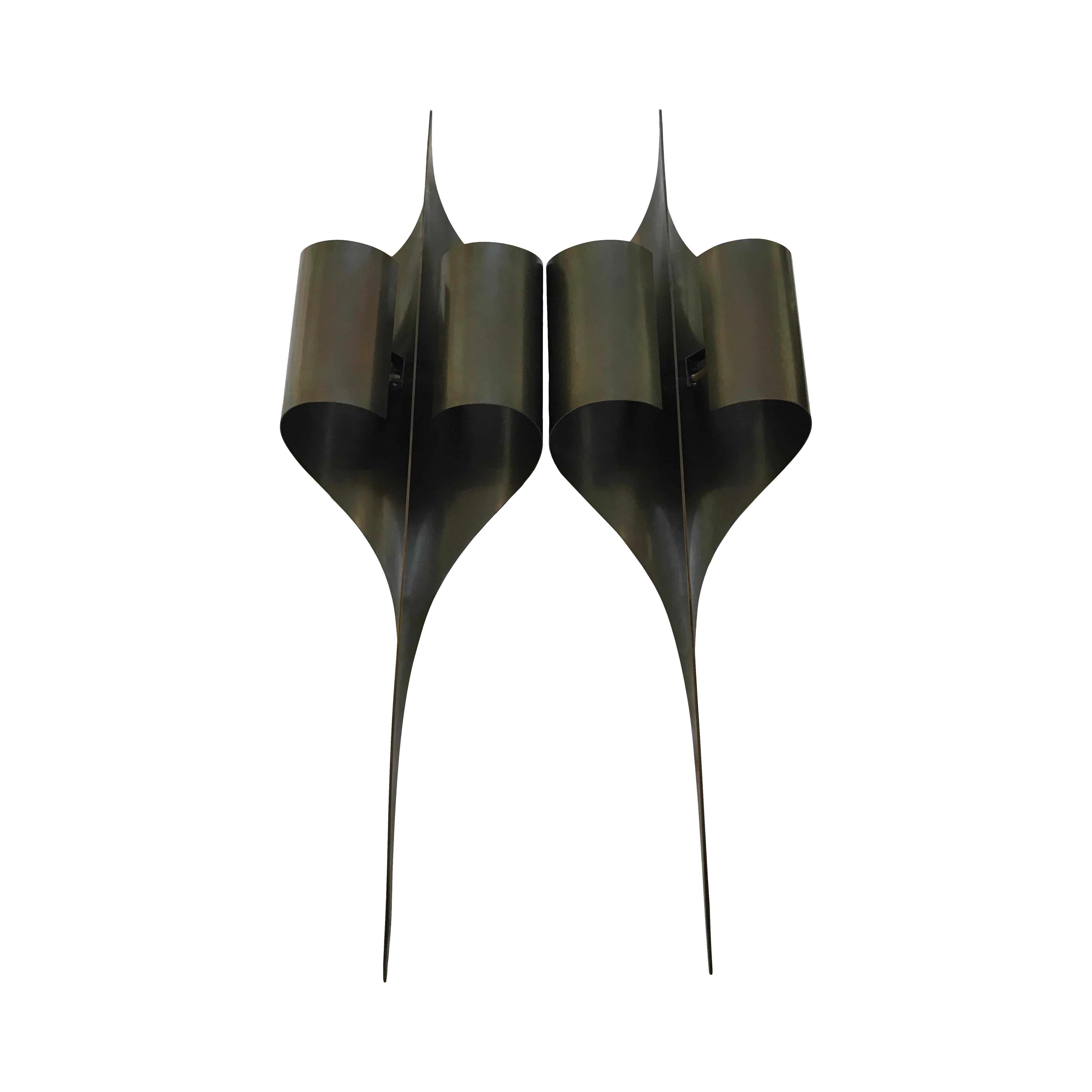 These stunning wall sconces by Maison Charles were made in this century but to the exact original design by Jacques Charles in the late 1960s and early 1970s.
Part of the renowned extensive Inox collection which was all originally made of curved