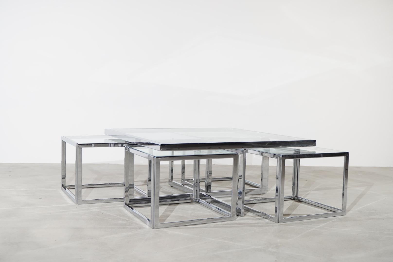 Extremely rare Maison Charles coffee table with 4 side tables in chromed steel. 

Very handy, because you can simply slide the four side tables under your table.

Maison Charles was originally founded in 1908 by Ernest Charles in the former