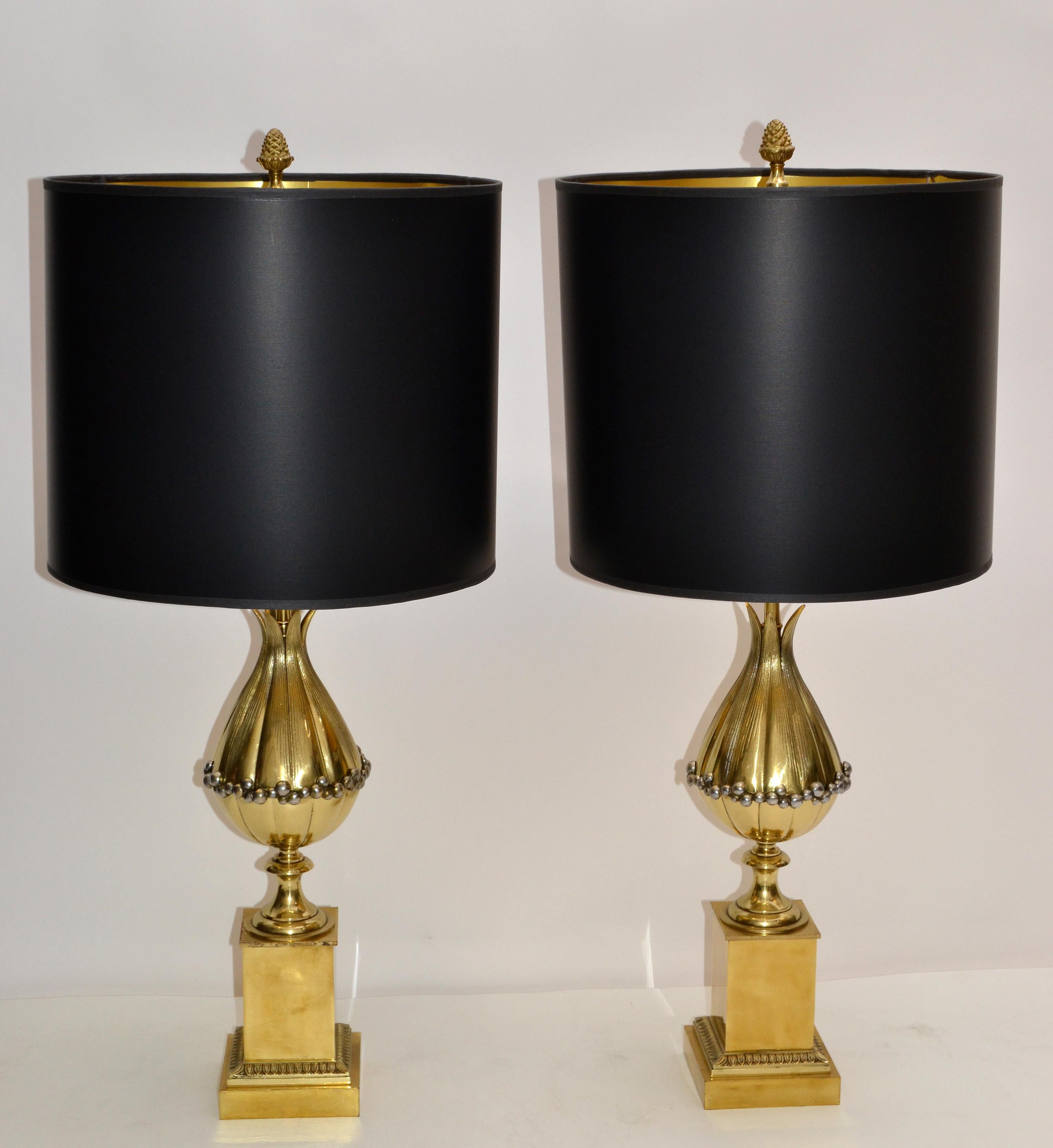 Superb pair of Maison Charles French Art Deco lotus table lamp in bronze with black and gold paper shade.
US rewired and in working condition and each Lamp takes two light bulbs max 40 watts, LED work too.
Measure:
Base is 4.5 inches by 4.5