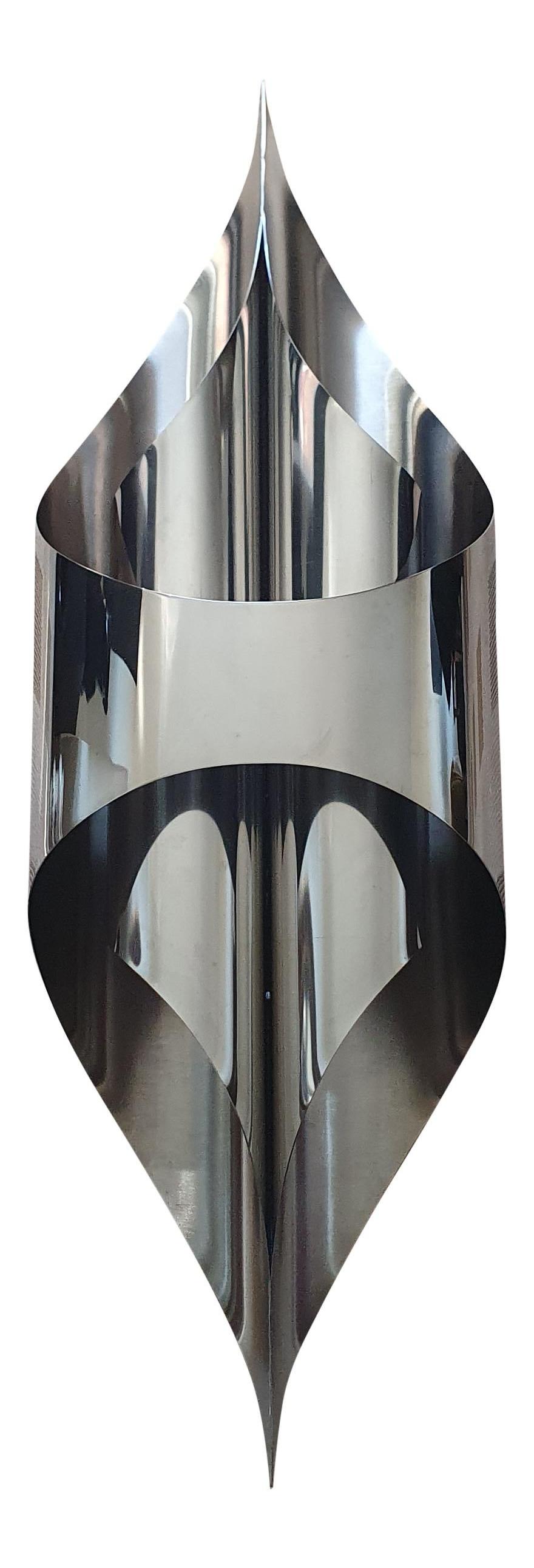 This stunning wall sconces by Maison Charles was made in this century but to the exact original design by Jacques Charles in the late 60s and early 70s.
Part of the renowned Inox collection and originally made of curved sheet steel, this one is
