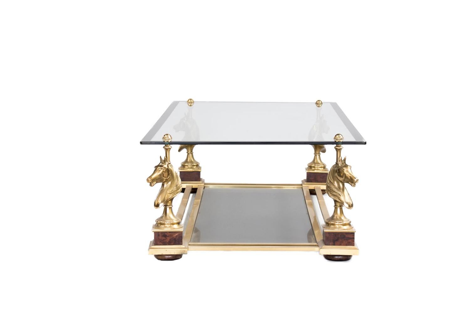 Maison Charles, in the style of.

Horse coffee table in gilt bronze and glass standing on four legs in horse head shape standing on thuya burl painted cubes and finishing by wood bun foot. Legs are linked each other by a stretcher made with double